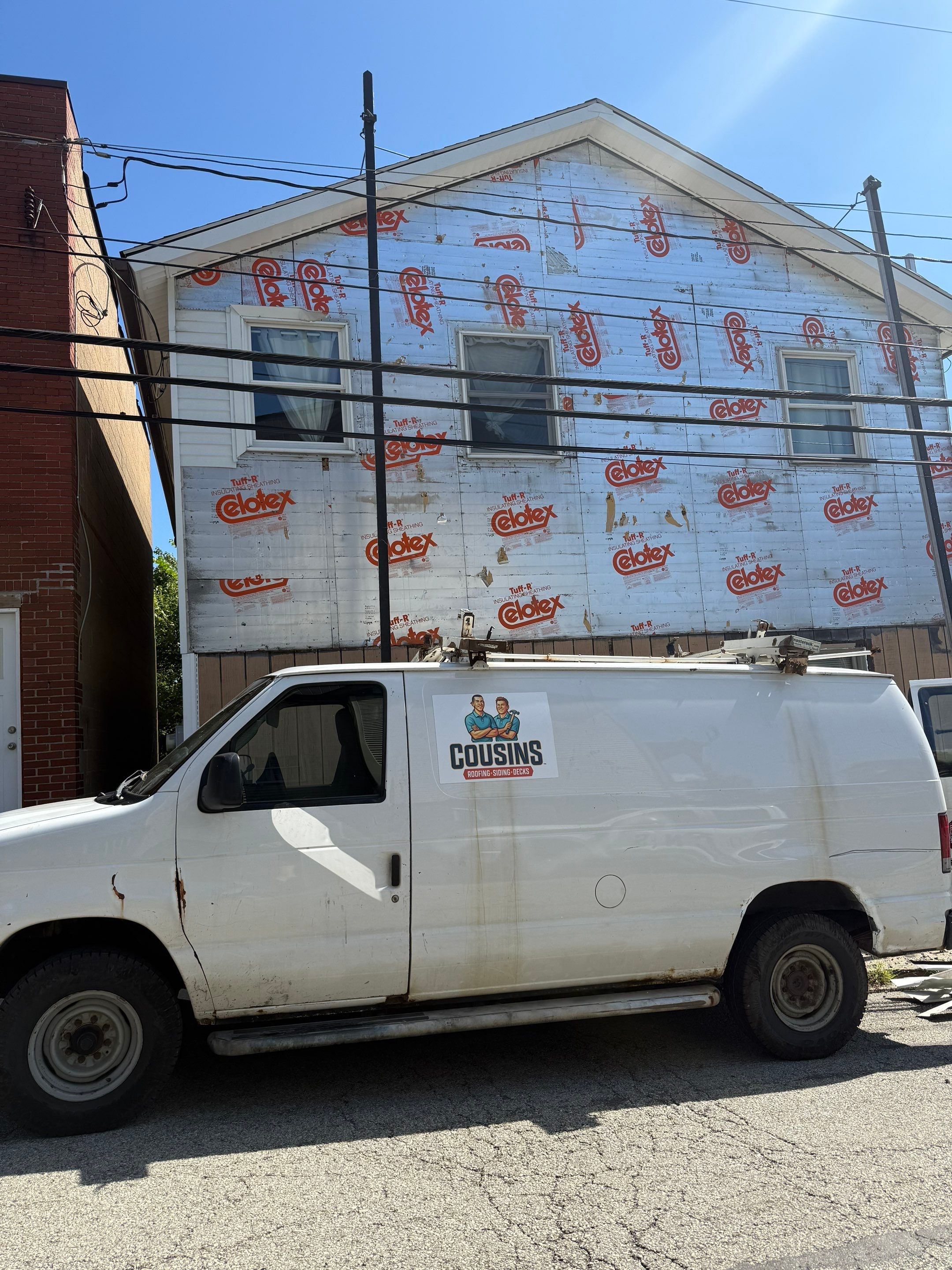 White siding  by Cousins Roofing Siding & Decks