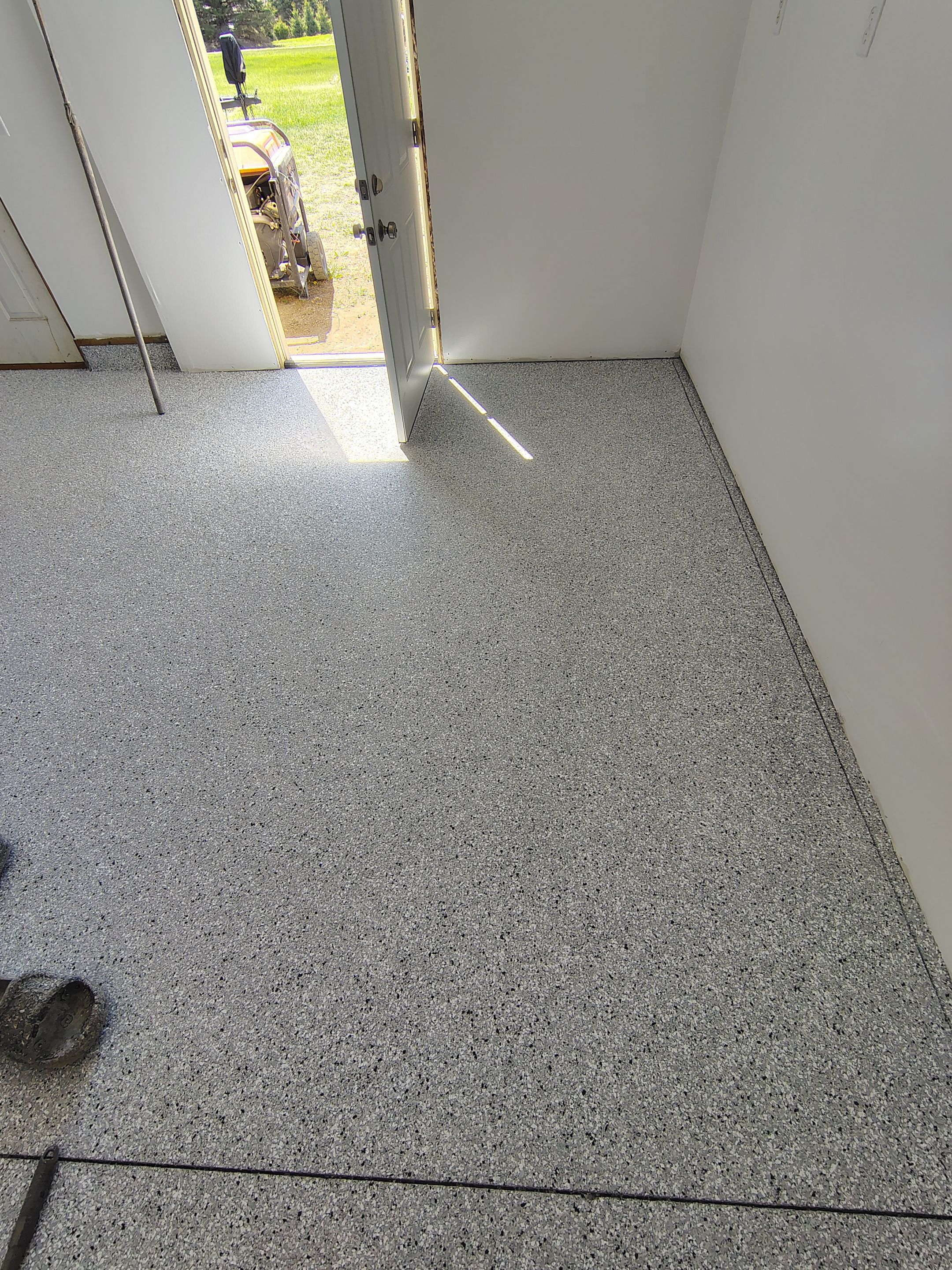 Decorative Chip Concrete Coating Installation in Luverne by Select Painting, Coatings & Garage Cabinets