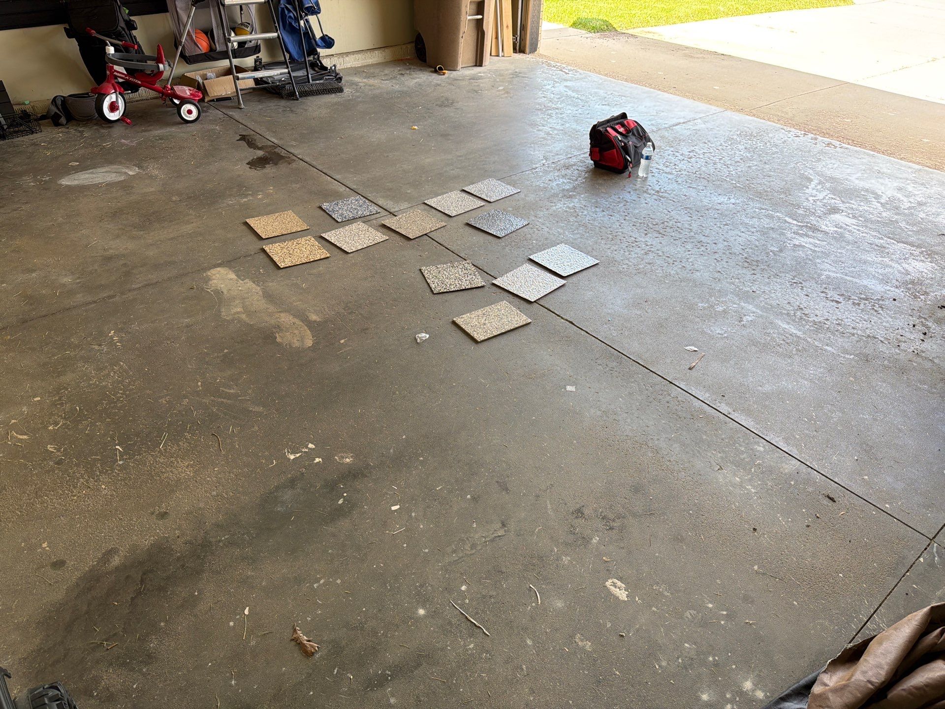 Cabin FEver Flake Garage Floor Coating Installation in Sioux Falls by Select Painting, Coatings & Garage Cabinets
