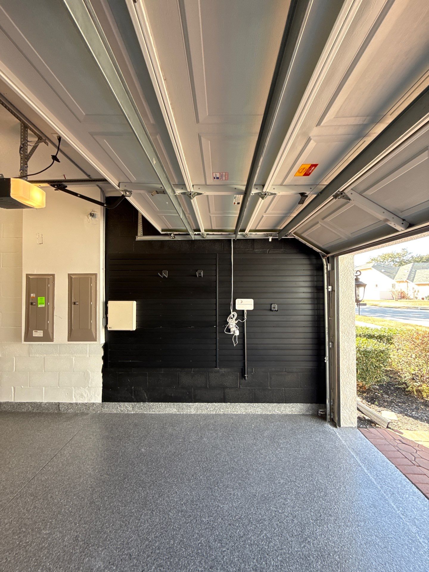 Full Garage Organization and Polyaspartic Floor Coating in Land O' Lakes by Square 1 Garage and Closet Solutions