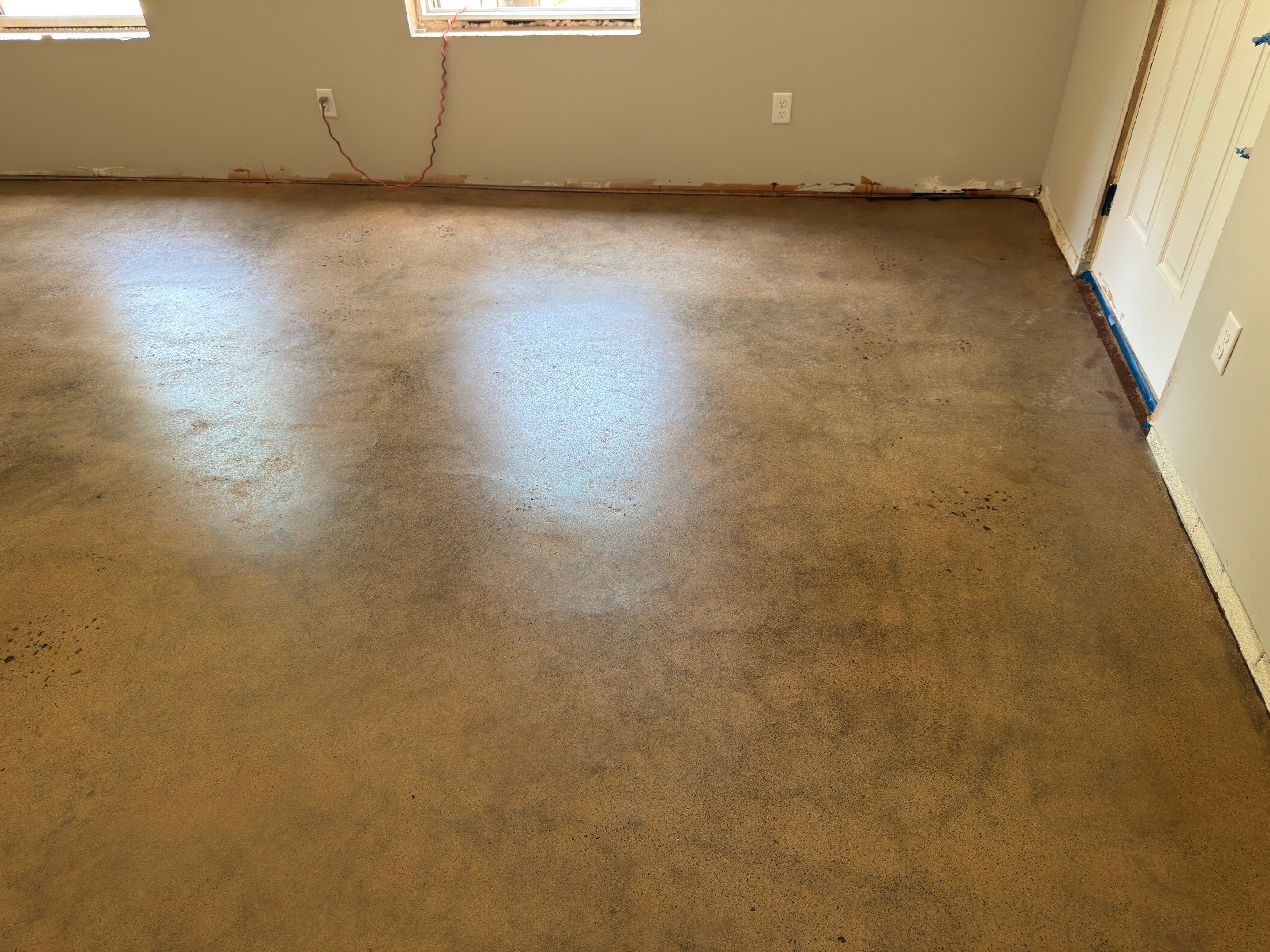 Stained Concrete using Antique Cork by Elite Floor Solutions