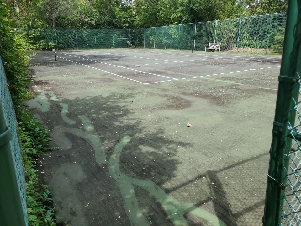 Tennis court cleaning by Northern Power Washing LLC.
