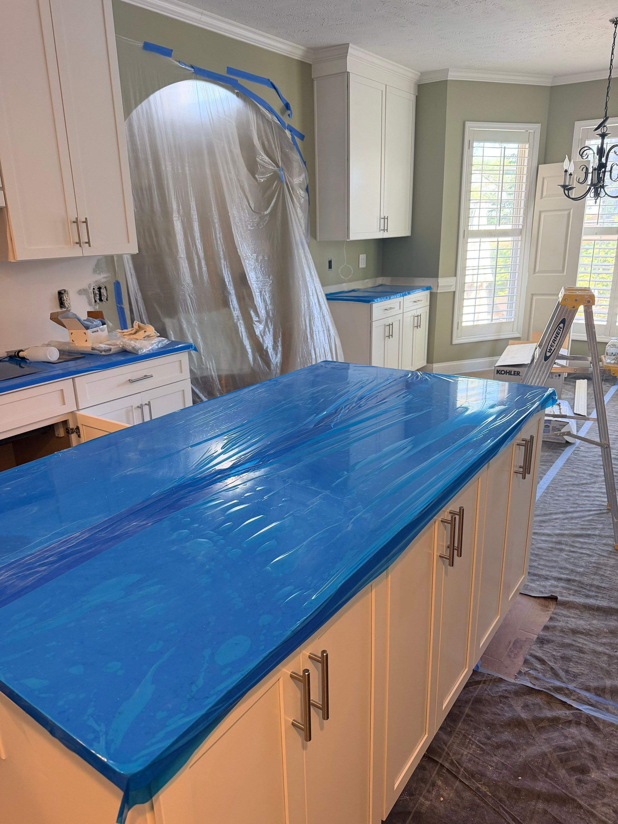Complete Kitchen Renovation Featuring White Shaker Cabinetry in Fayetteville by Karcher Roofing & Construction