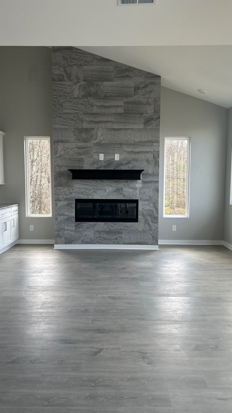 Floor to Ceiling Fireplace Surround by Footprints Floors of Nashville