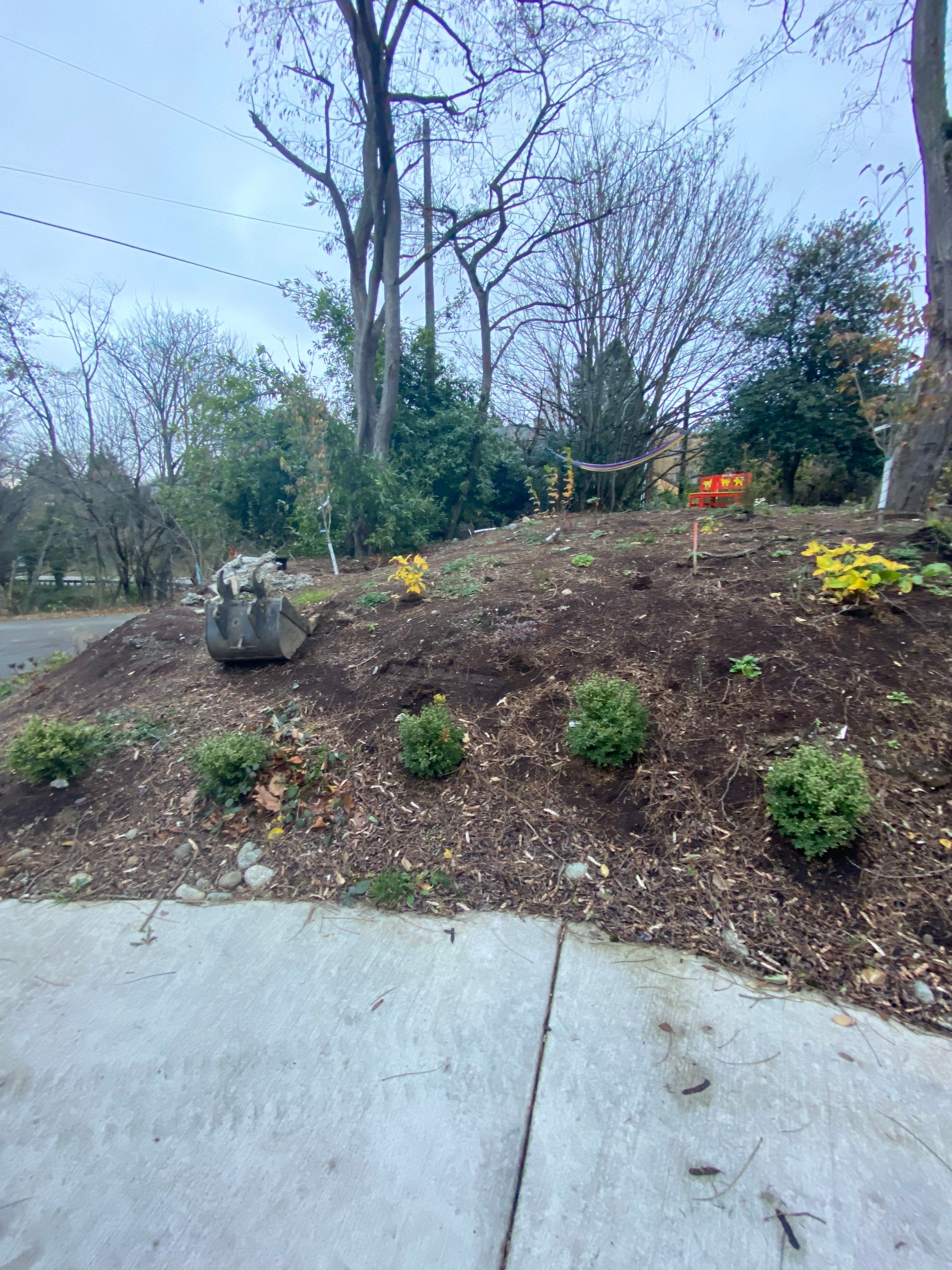 Patio Installation using Concrete, Retaining walls, and Turf install by Jireh Asphalt & Concrete Inc 