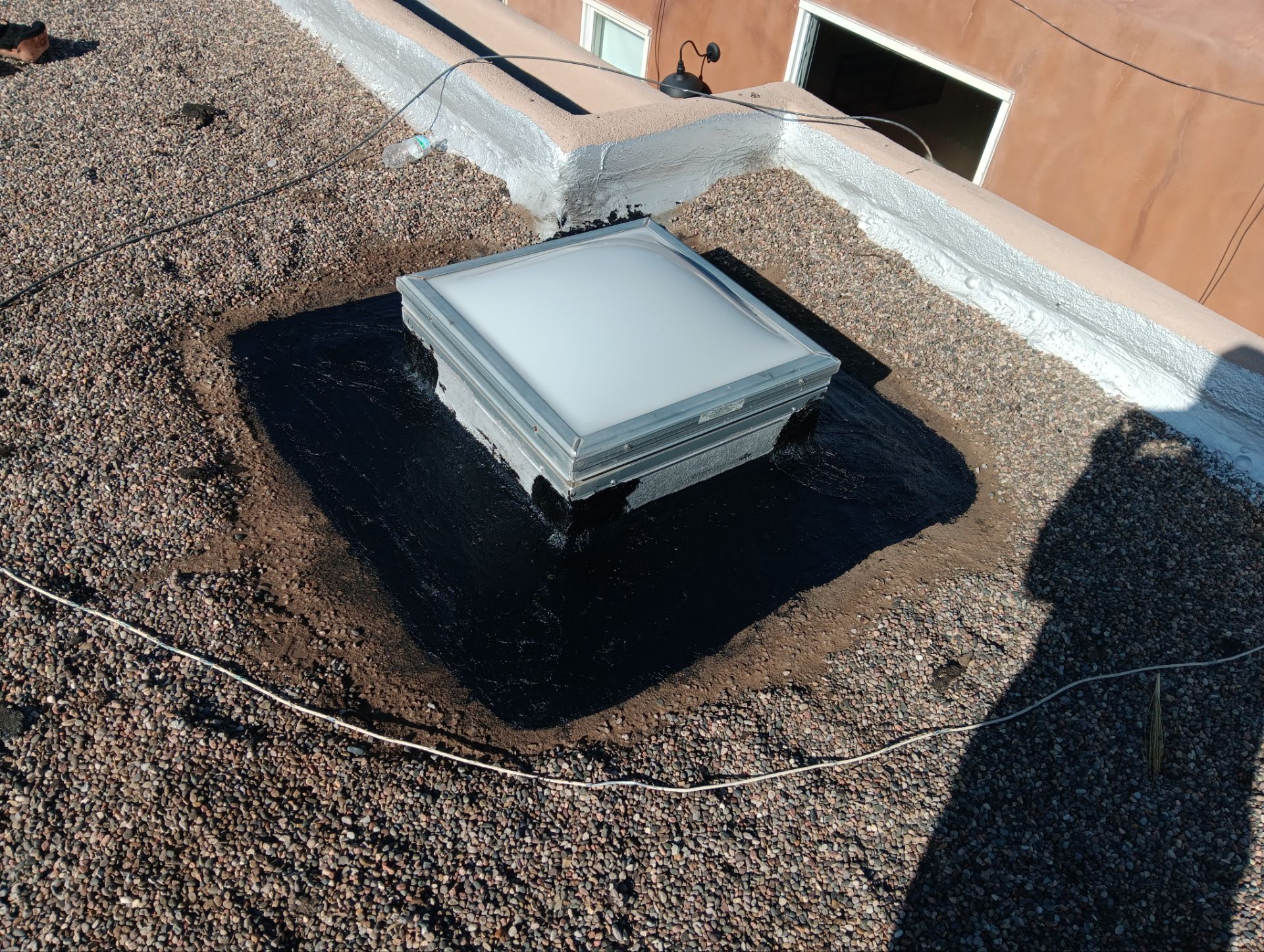 Roof Maintenance and Low-E Tempered Glass Skylight Replacement on Gravel Roof in Northwest Albuquerque by Doyle Roof Masters Inc
