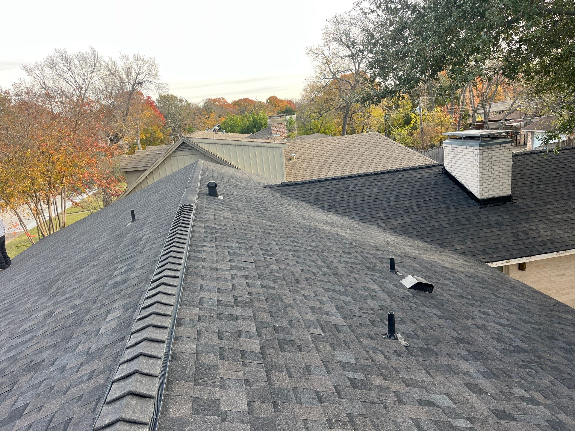IKO Brownstone- White Brick  by Tejas Roofworks + Restoration