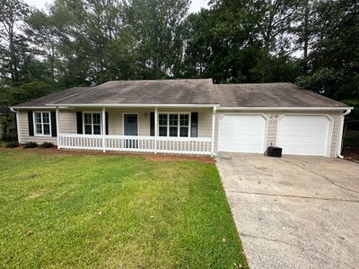 Exterior Siding Painting and Picket Fence Installation in Powder Springs