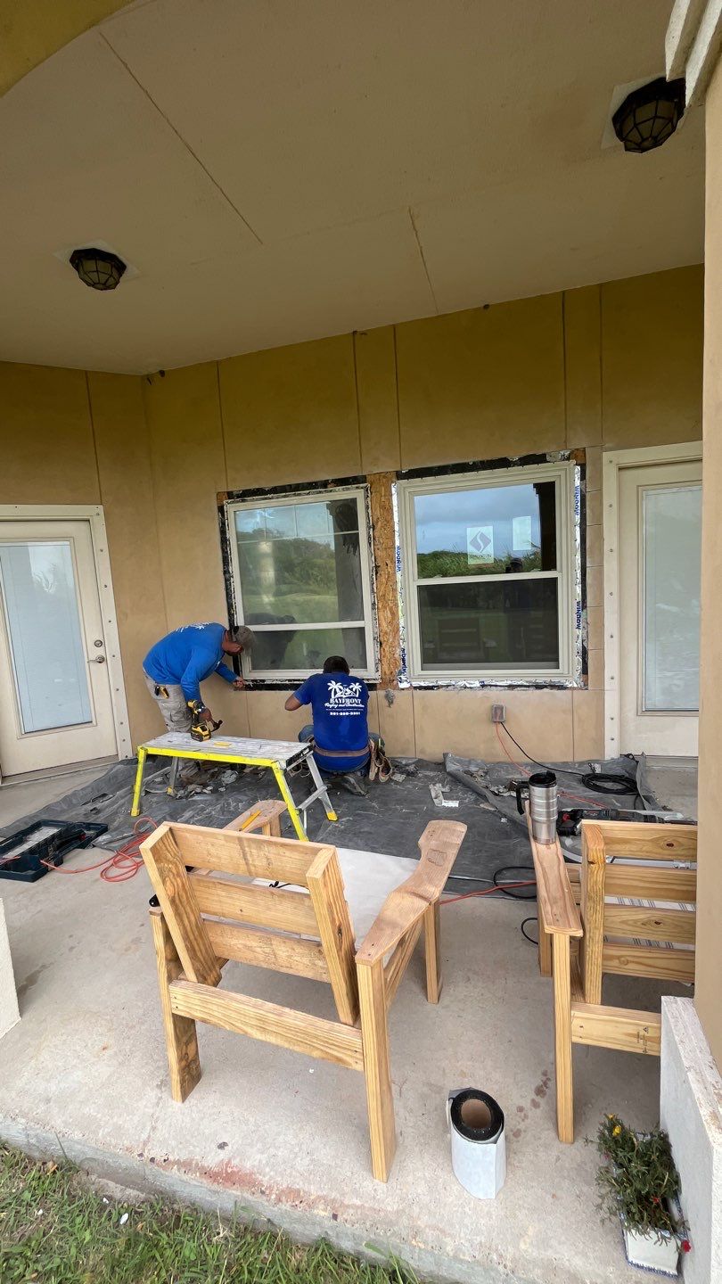 Installing Windows on a Submarine  by Bayfront Roofing and Construction