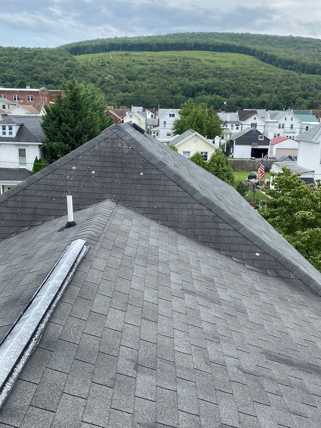 Charcoal Metal Roof & Blue Siding — A Refreshing New Look by Esh Builders