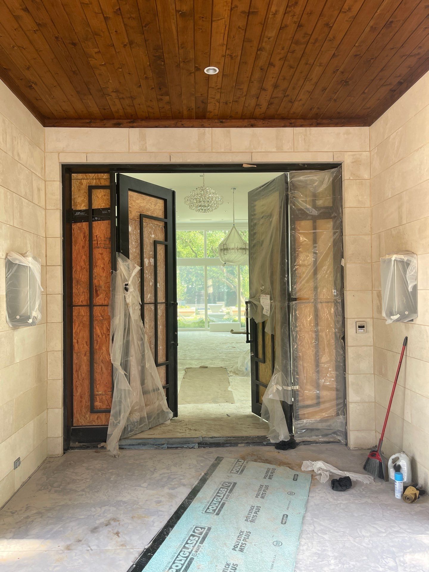 Modern Metal and Glass Entryway Installation with Custom Hardware Finishing in Dallas by Solara Custom Living