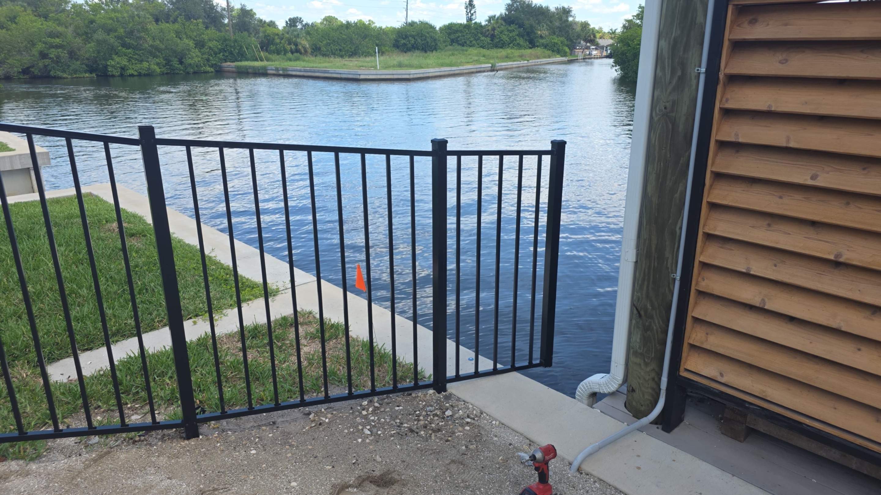 Black Aluminum Fencing and Paver Walkway Installation in Punta Gorda by True Fence LLC
