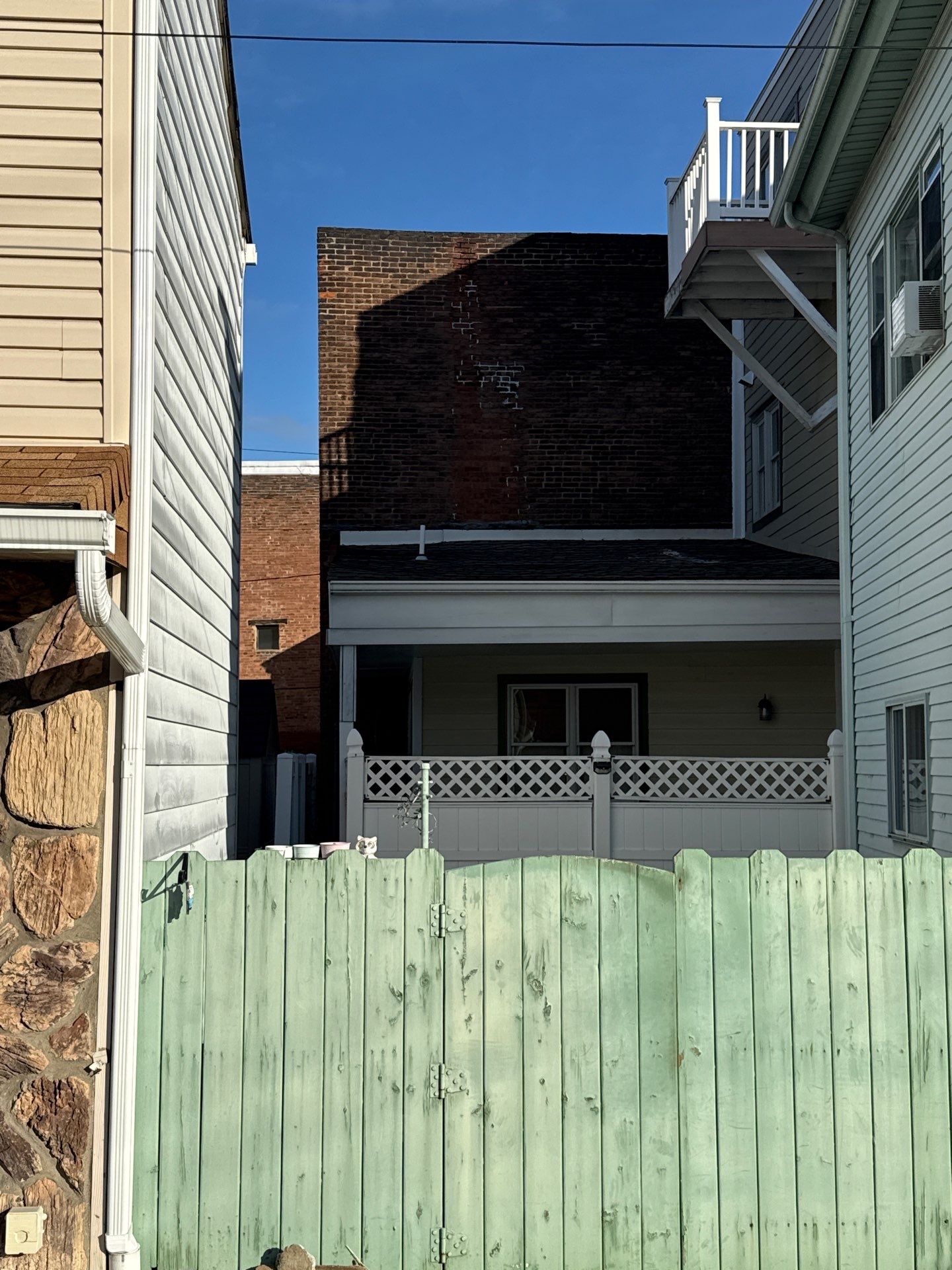 Elevated Multi-Level Composite Deck with Spiral Staircase in Pittsburgh by Cousins Roofing Siding & Decks