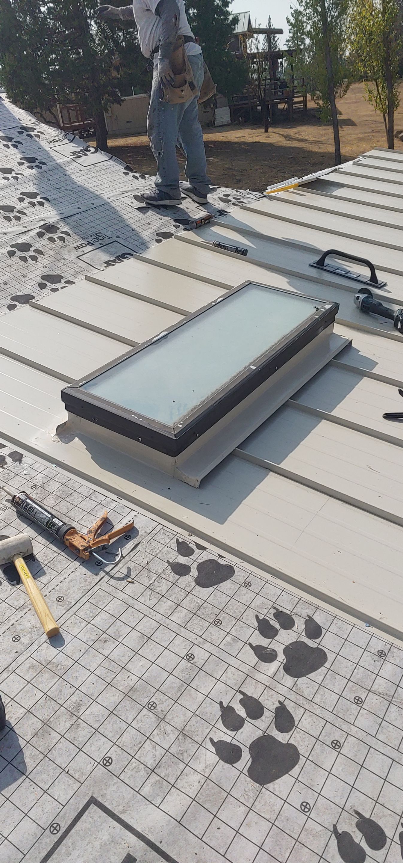 Residential Roofing Installation using Standing seam metal roofing system by Straight Edge Roofing Inc