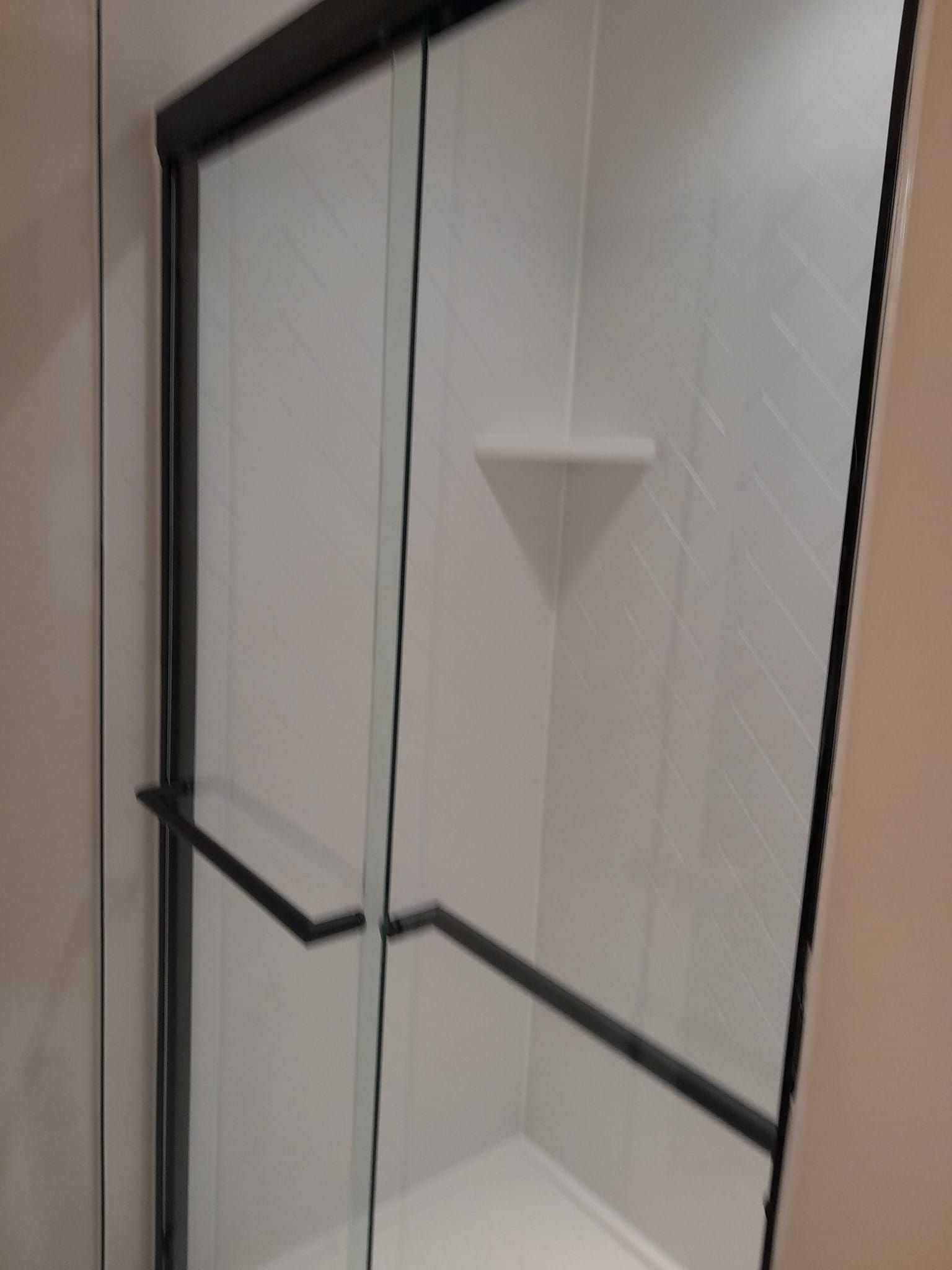 Shower remodel using Maintenance free wall system and shower pan with glass door by Window Depot of Annapolis