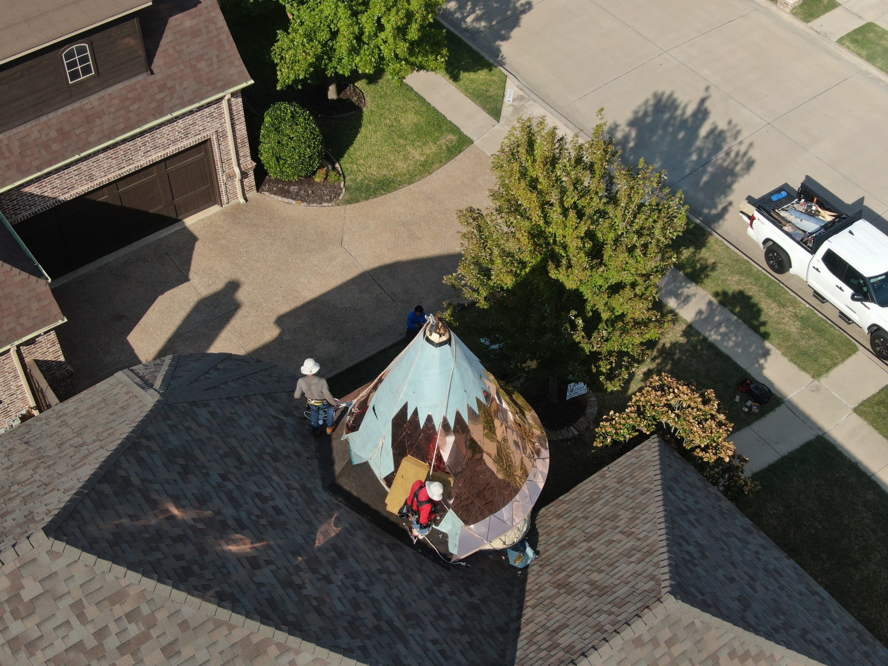 Installing Custom copper turret and Malarkey Vista Class 4 shingles Hail Damage Upgrade by Becker Roofing and Exteriors
