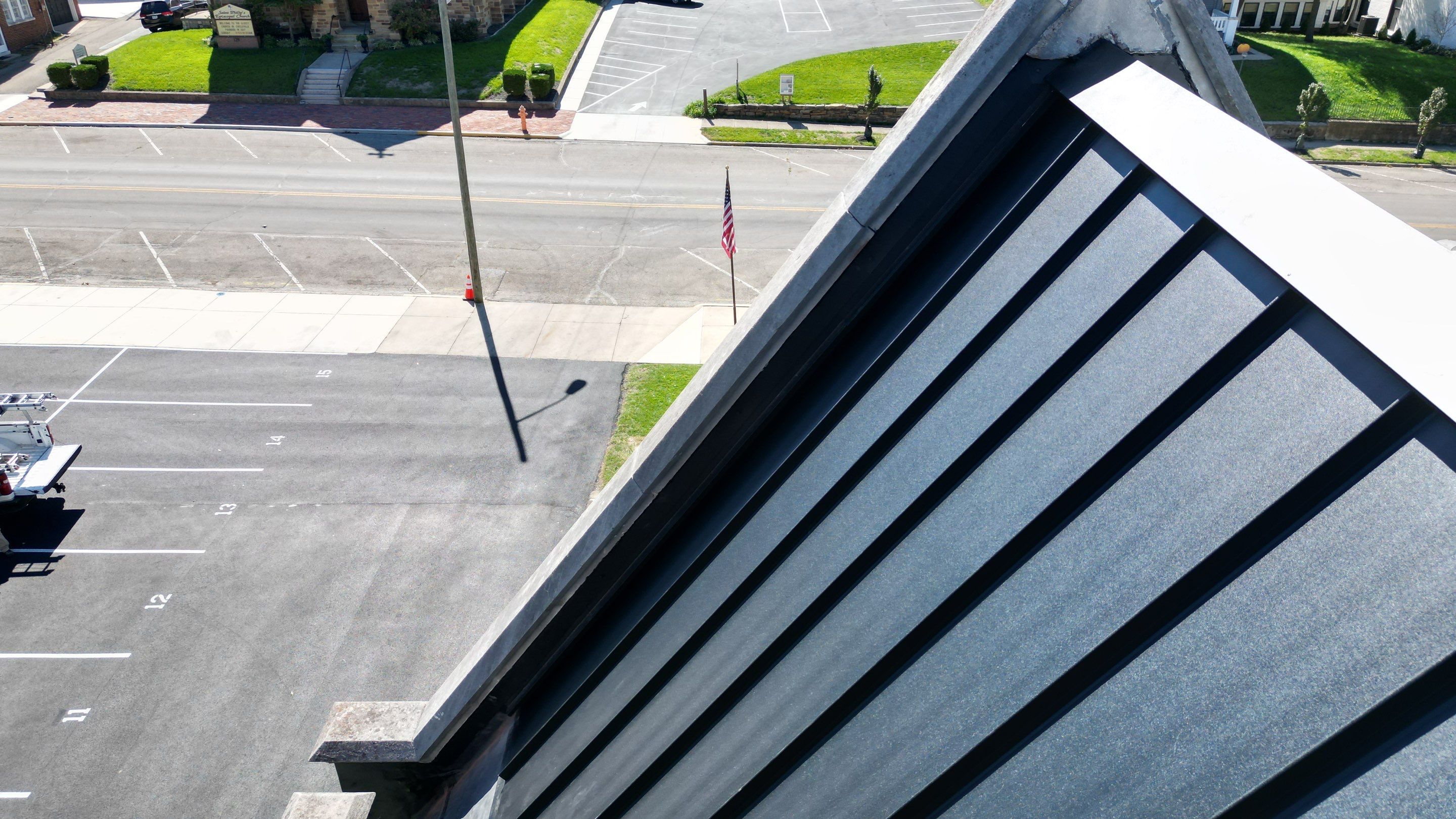 Commercial Roofing Installation using Standing Seam Metal - Frost Black by RoofX 