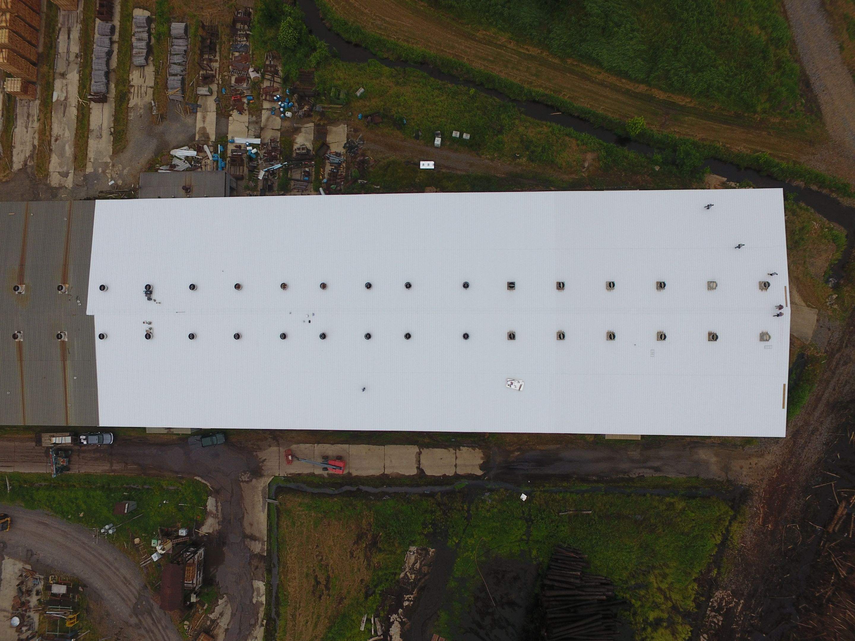 Commercial Roofing Installation using Aluminum Roofing panels by Hostetler Roofing