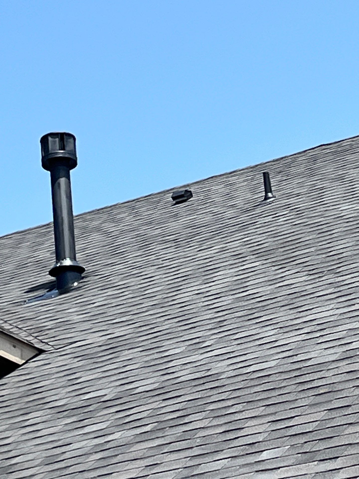 IKO Glacier-Brown Brick house by Tejas Roofworks + Restoration