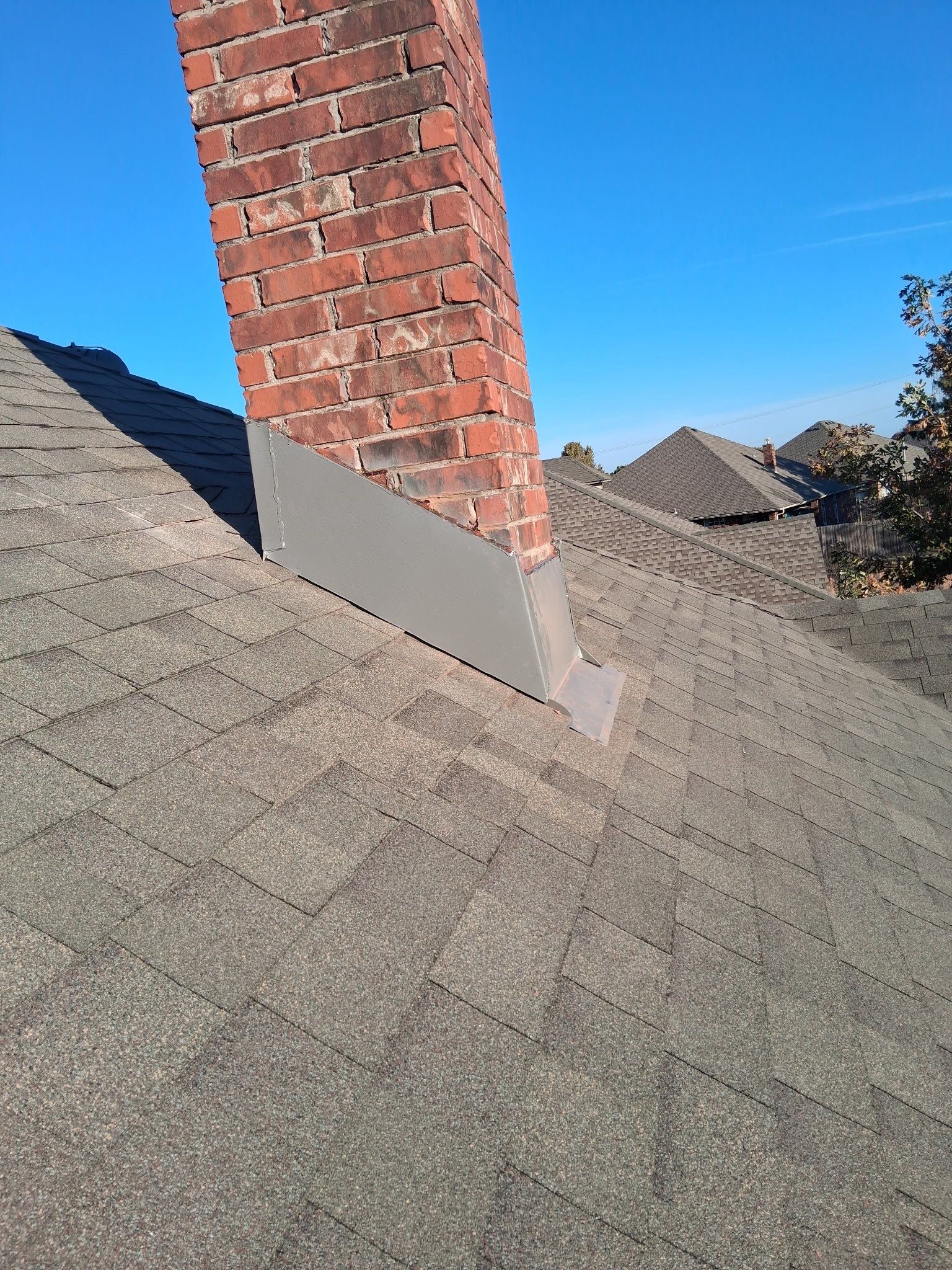 chimney flashing repair in Norman by McCann's Roofing and Construction