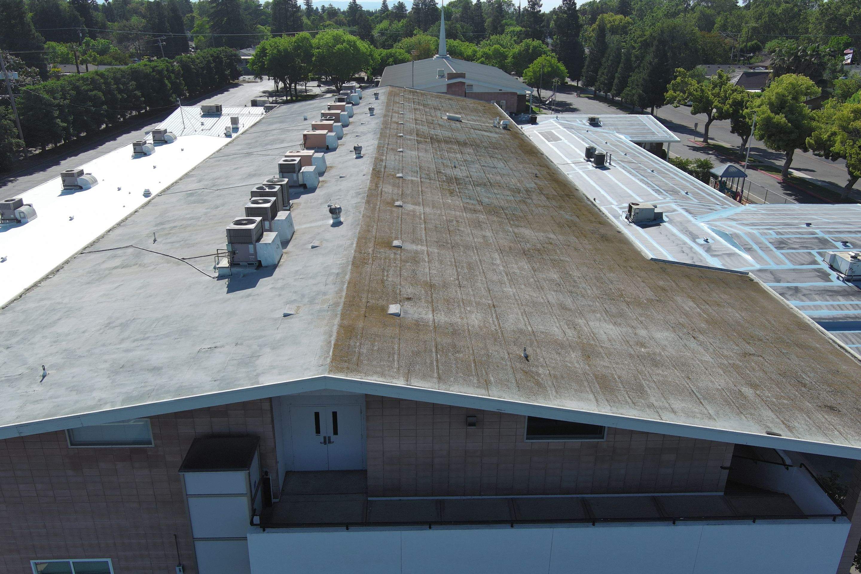 Single-ply restoration system using Benchmark/PUMA XL coatings over TPO single-ply roofing by Straight Edge Roofing Inc