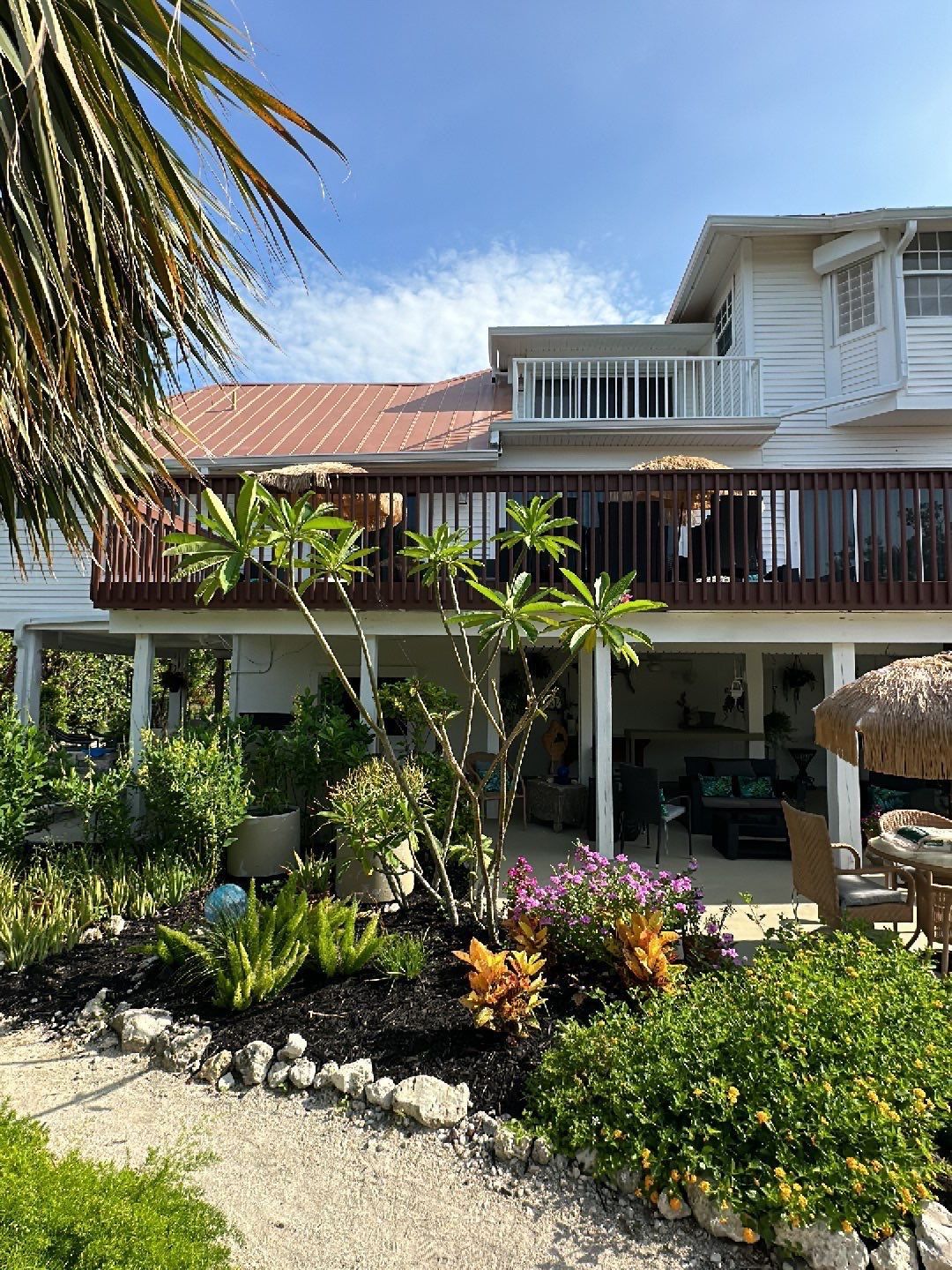 White K-Style Gutters Installed with White Downspouts in Sanibel FL by Gutter Professors