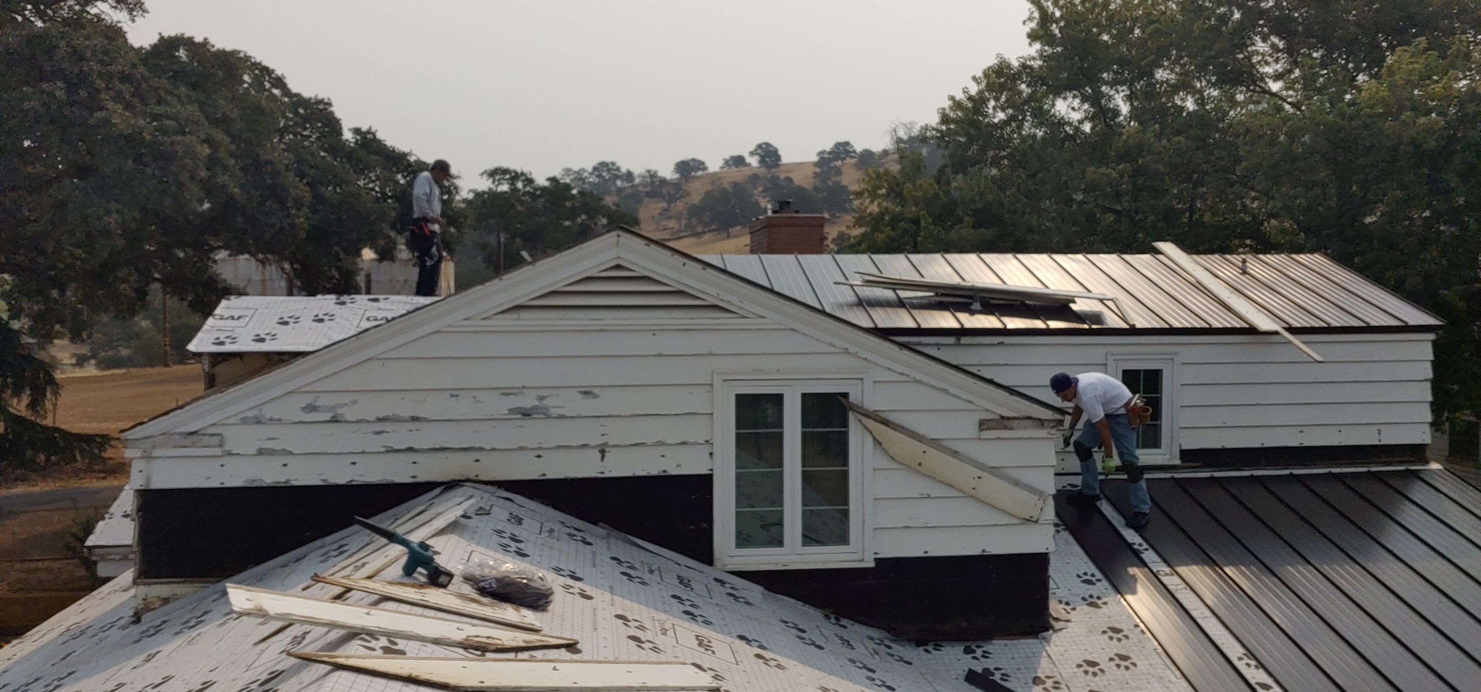 Residential Roofing Installation using Standing seam metal roofing system by Straight Edge Roofing Inc