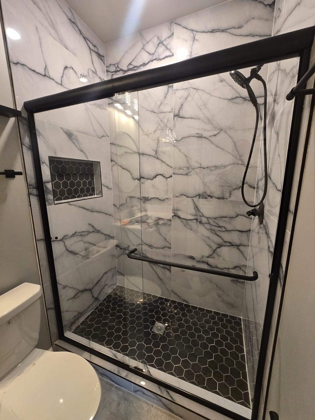 Tub to walk-in shower conversion by Prudencio