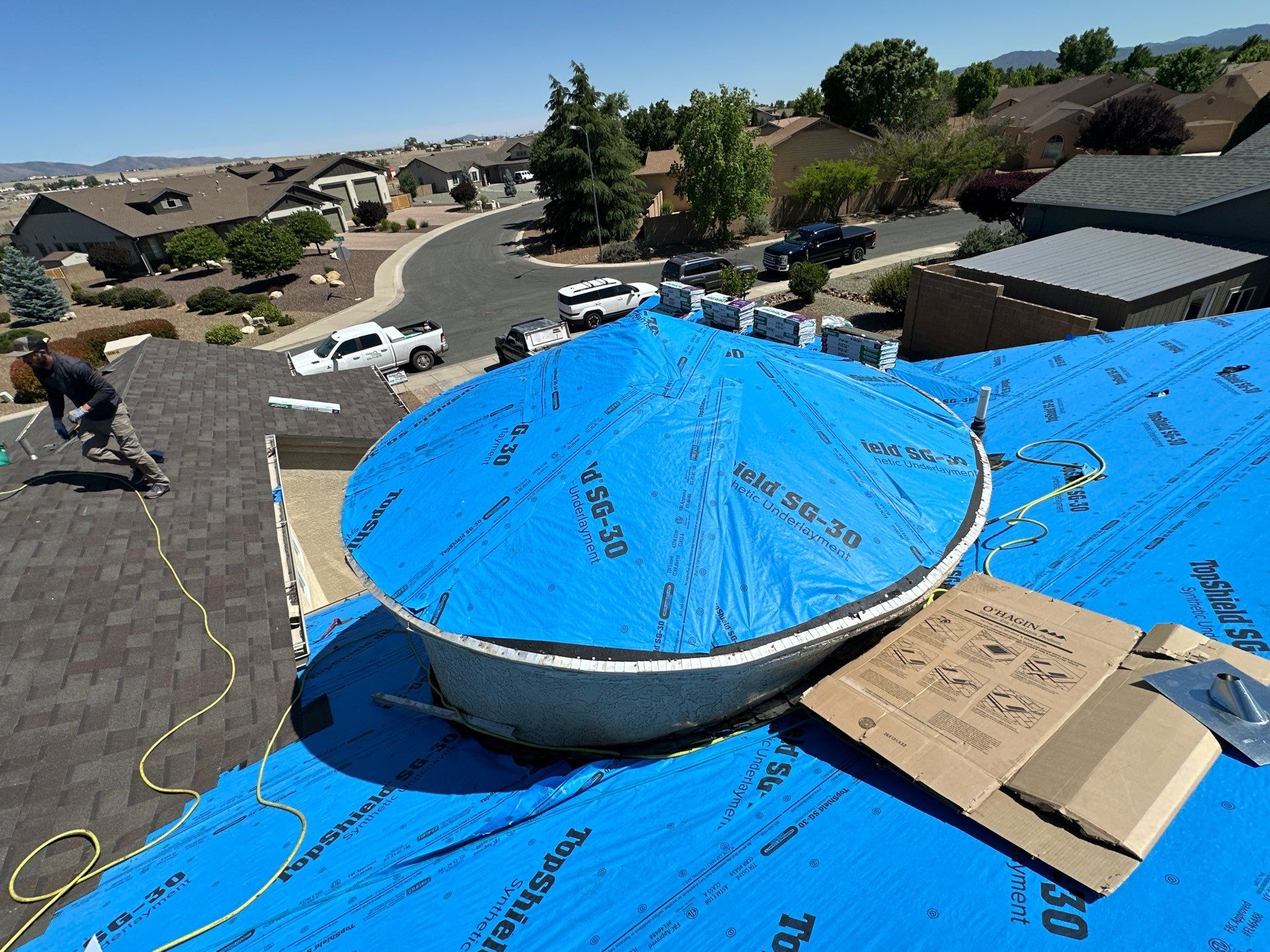 Residential Roofing Installation with Architectural Shingles and Turret Detail by Badger Roofing