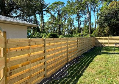 Wood Fence Installation using 6 Ft. Tall Pressure Treated Wood Shadowbox Fence