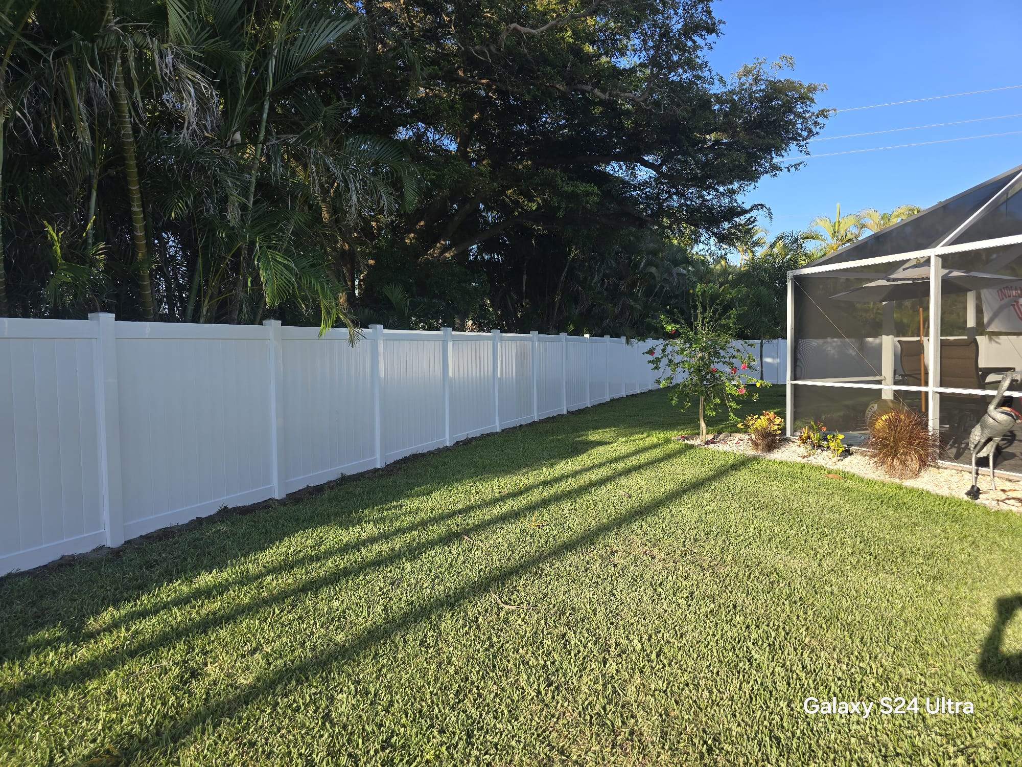 White Vinyl Privacy Fence and Double Gate Installation in Fort Myers by True Fence LLC