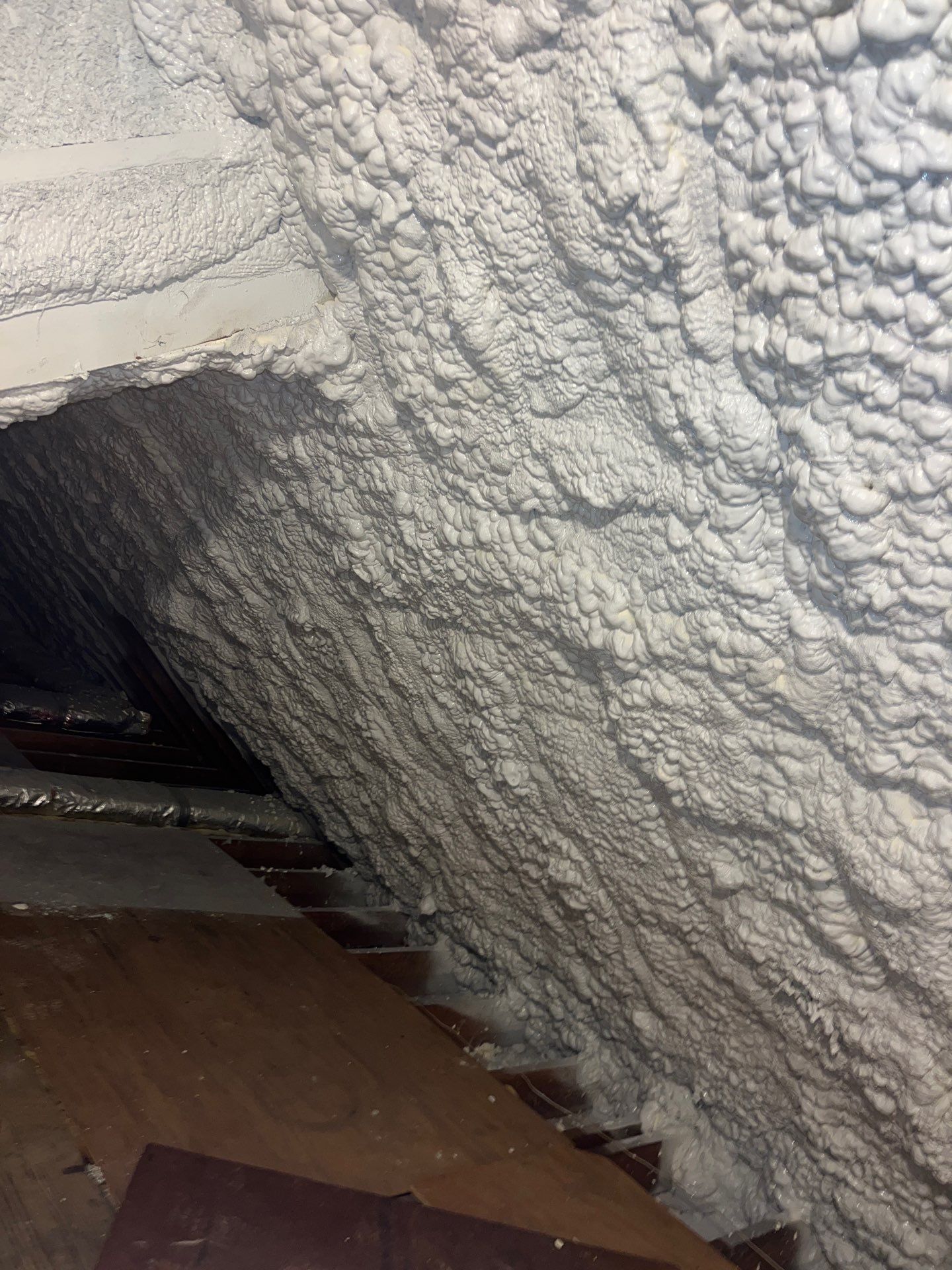 Attic Retrofit using open cell spray foam by NYS Foam & Energy