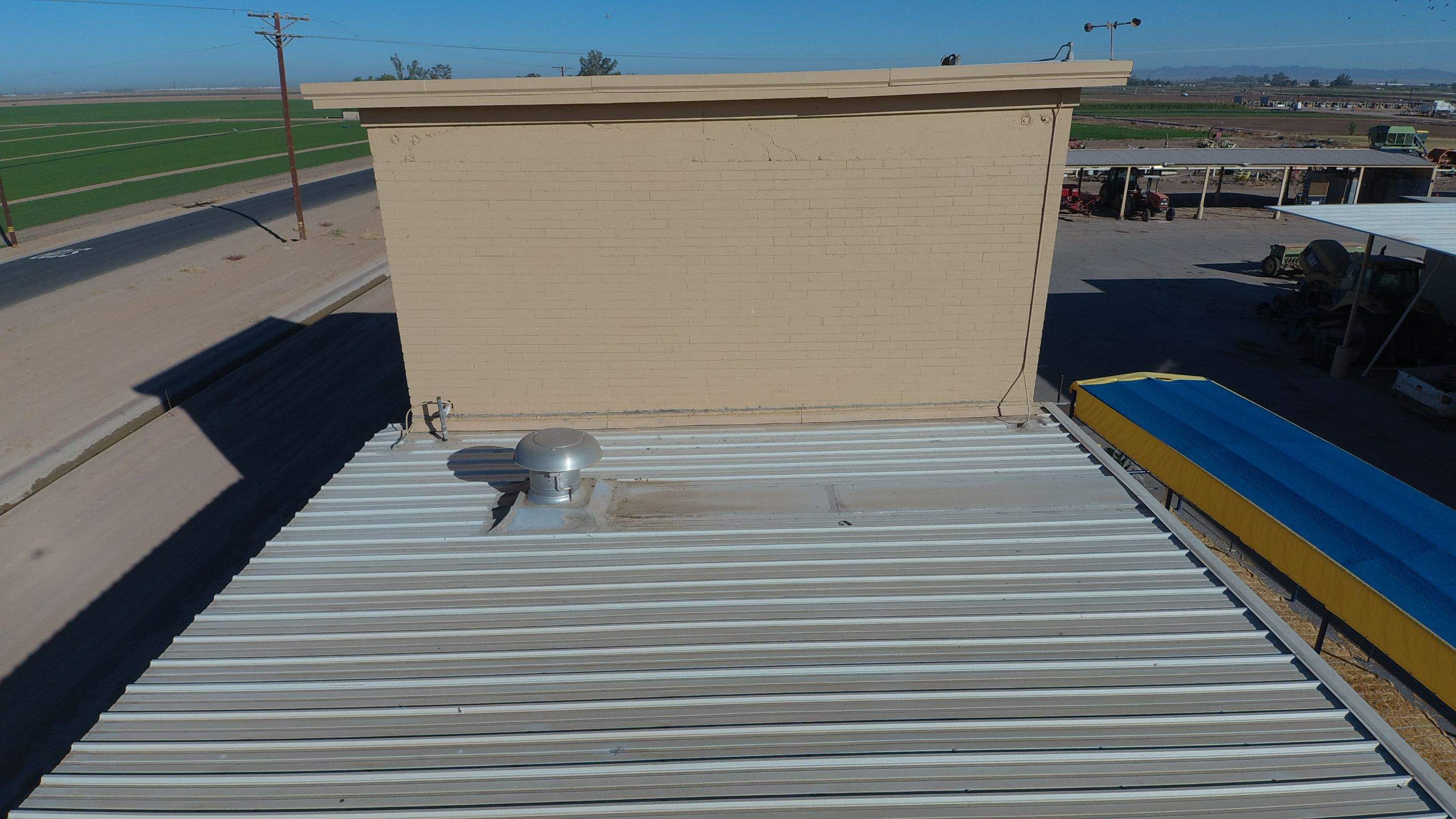 Metal roof restoration on commercial roof using Conklin Benchmark/PUMA XL fabric and coating by Straight Edge Roofing Inc