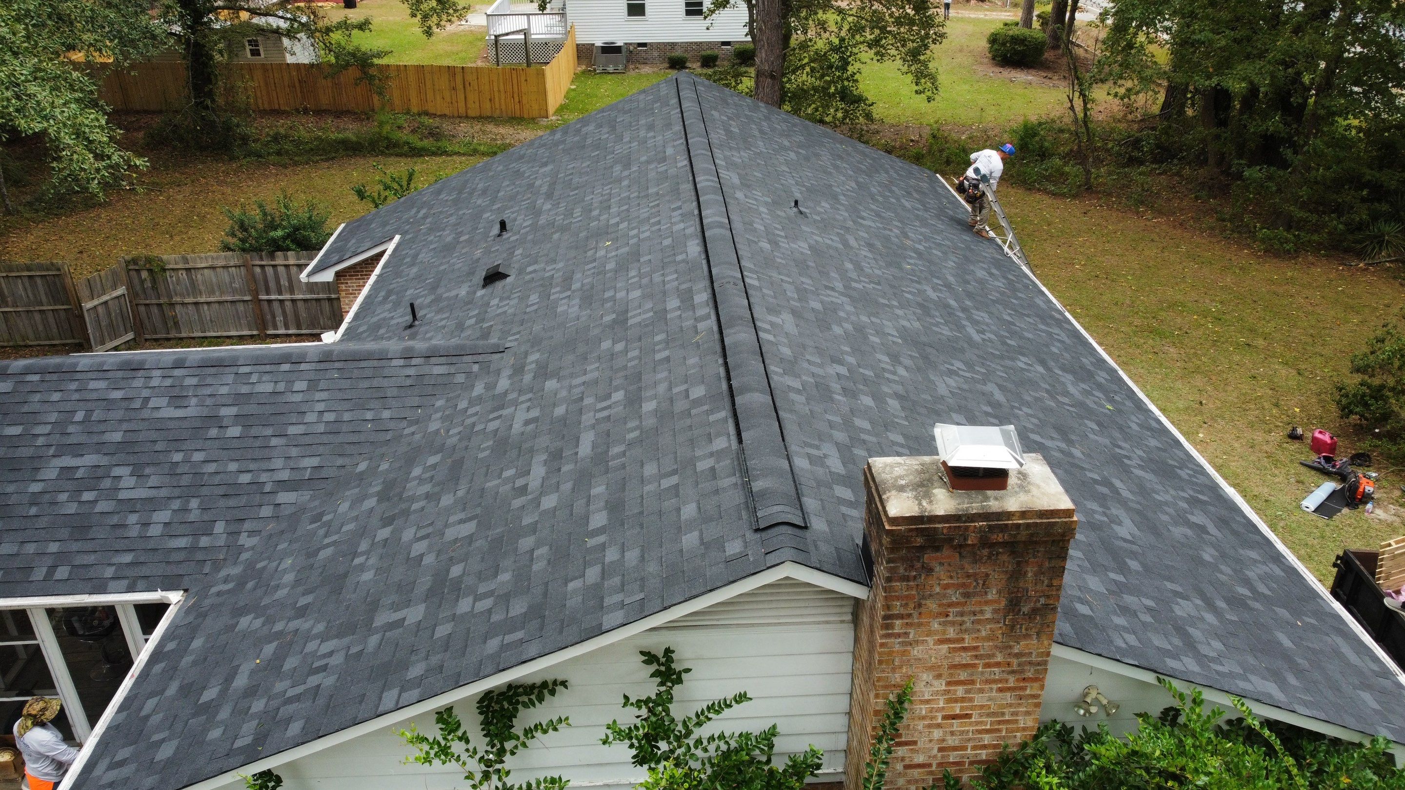 New Onyx Black Shingle Roof Replacement and Tree Damage Repair. by Midlands Roofing & Exteriors