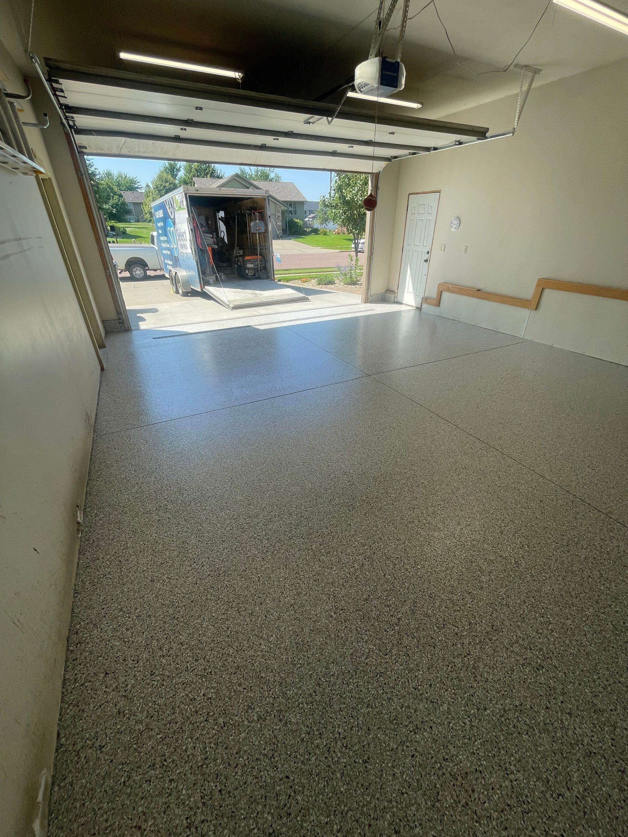 Multi-Stall Garage Floor Coating Installation in Sioux Falls by Select Painting, Coatings & Garage Cabinets