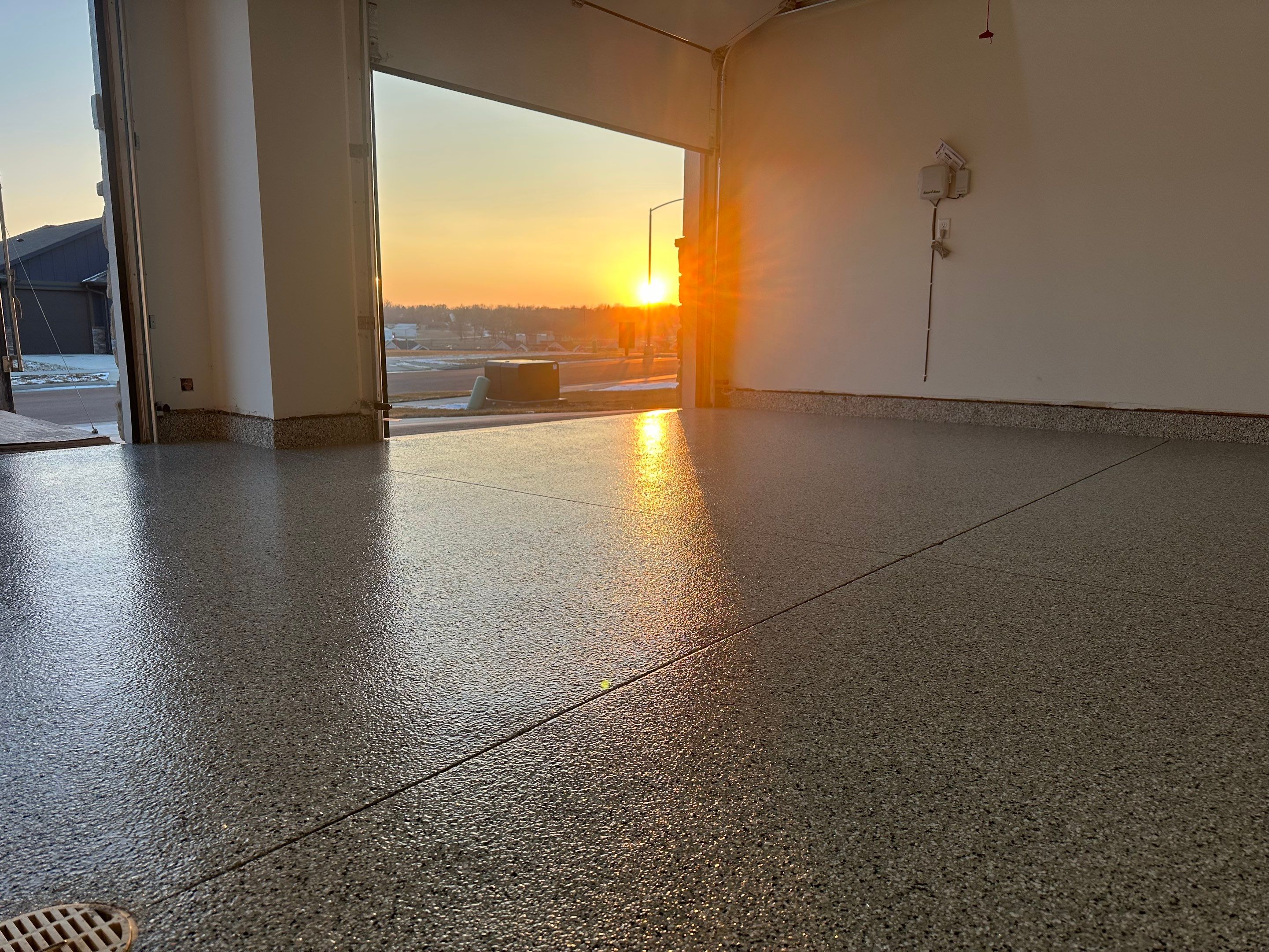 Cabin Fever Decorative Flake Garage Floor Coating in Sioux Falls by Select Painting, Coatings & Garage Cabinets