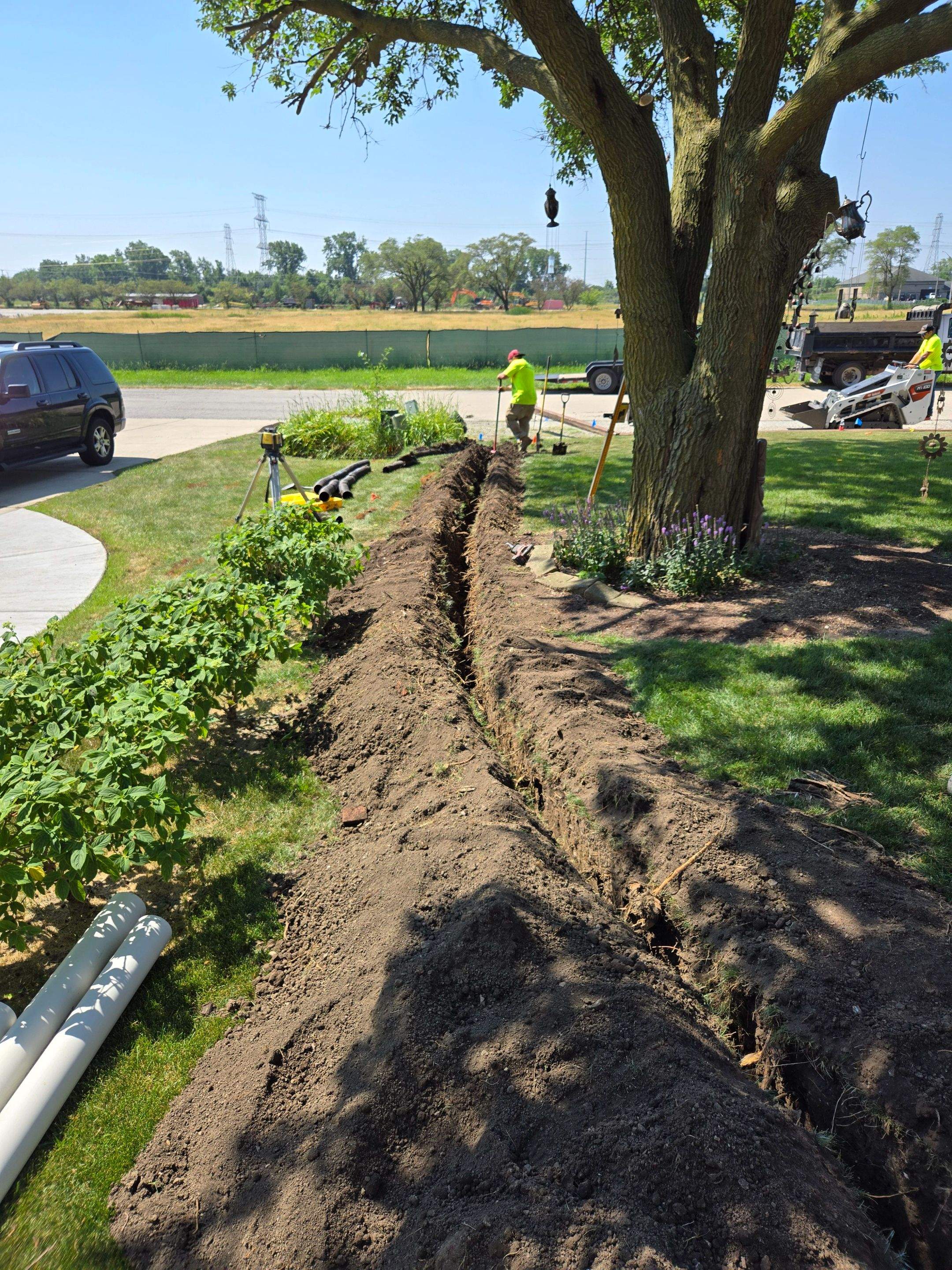 Burial of Sump Pump and Down Spout Discharges and Partial Waterproofing of Wall by Allied Water Services