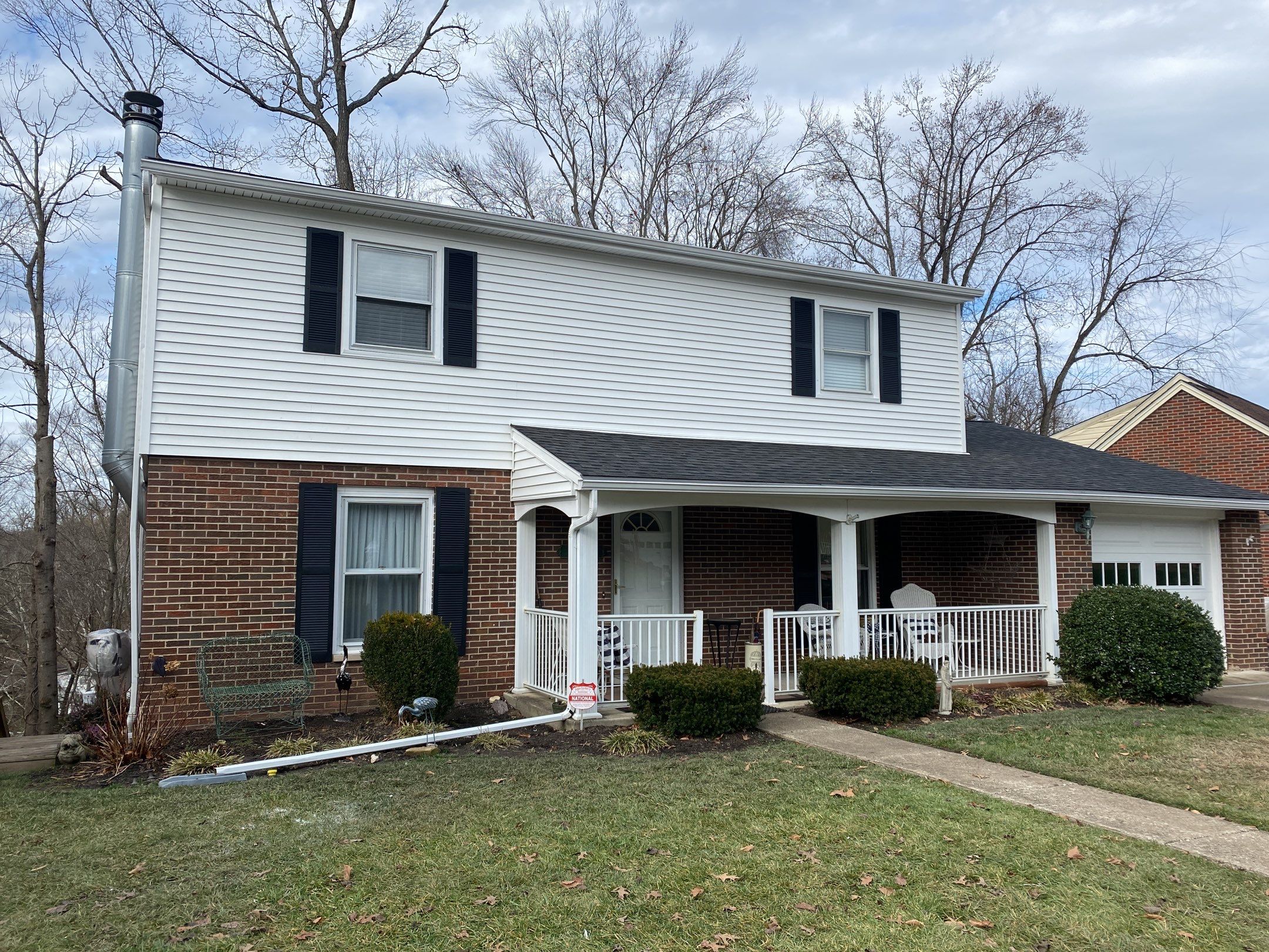 Replace dated vinyl siding with new white exterior Portfolio vinyl siding  by Secure Construction Company Inc