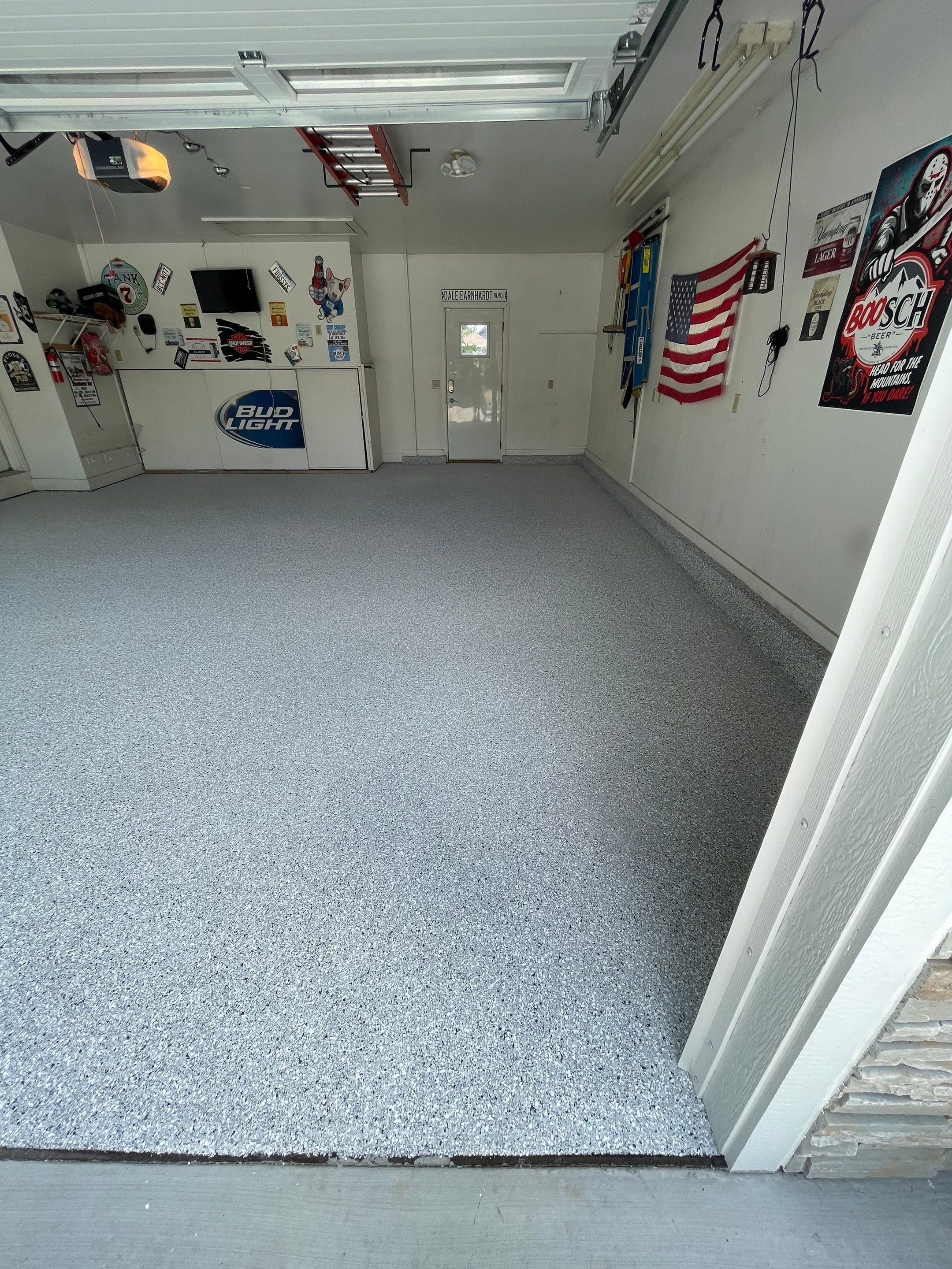 Residential Garage Floor Coating with Feather Grey Finish in Sioux Falls by Select Painting, Coatings & Garage Cabinets