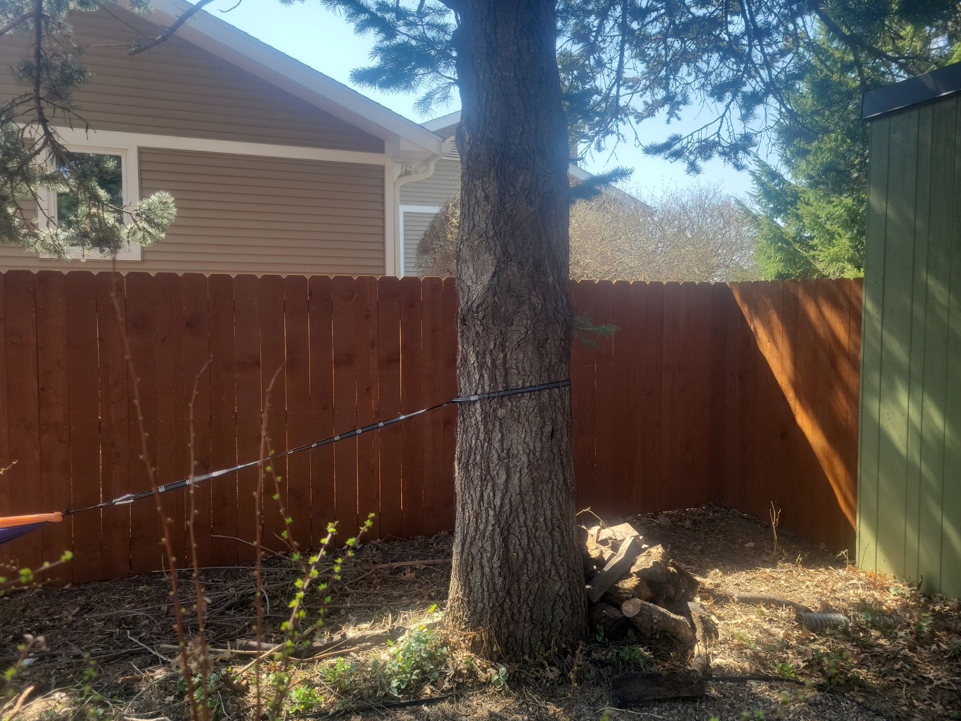 Stained Cedar Wood Privacy Fence Installation in Cedar Falls by Perfect Picket Fence and Stain