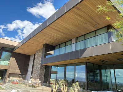 Exterior wood refinish & glass pool enclosure