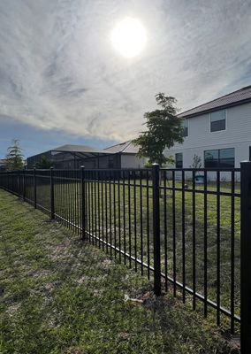 Aluminum Fence Installation using Black 3 Rail Aluminum Fence