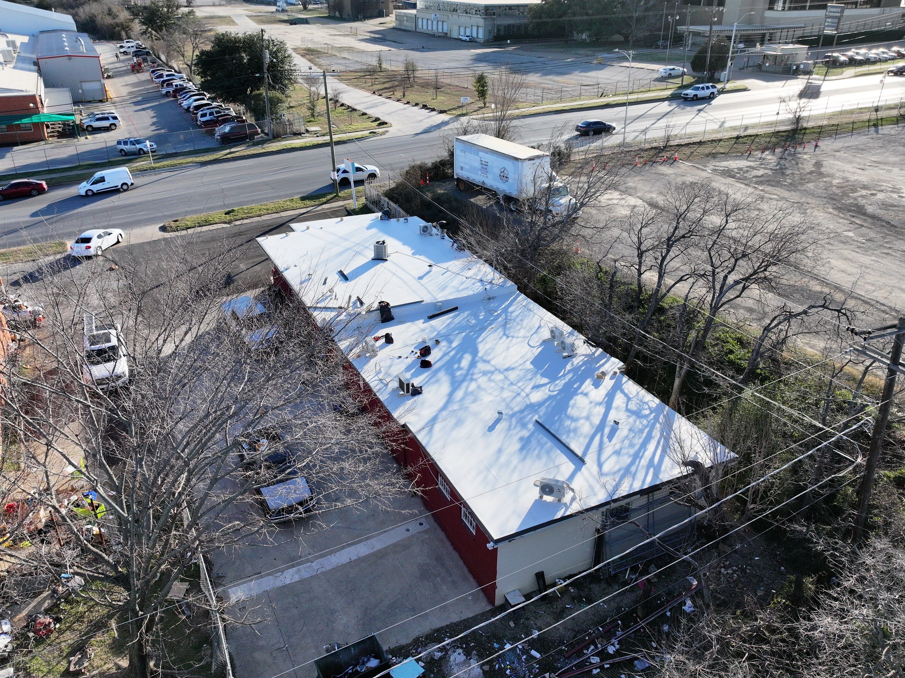 Commercial roofing overlay using GAF TPO over an old ballast roof by Becker Roofing and Exteriors