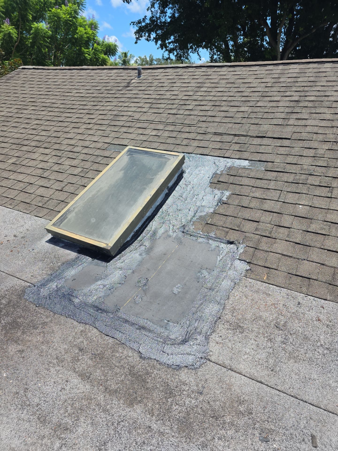 REPLACE NON APPROVED SKYLIGHT ALONG WITH CLOGED GUTTER by Morton Roofing, Inc.