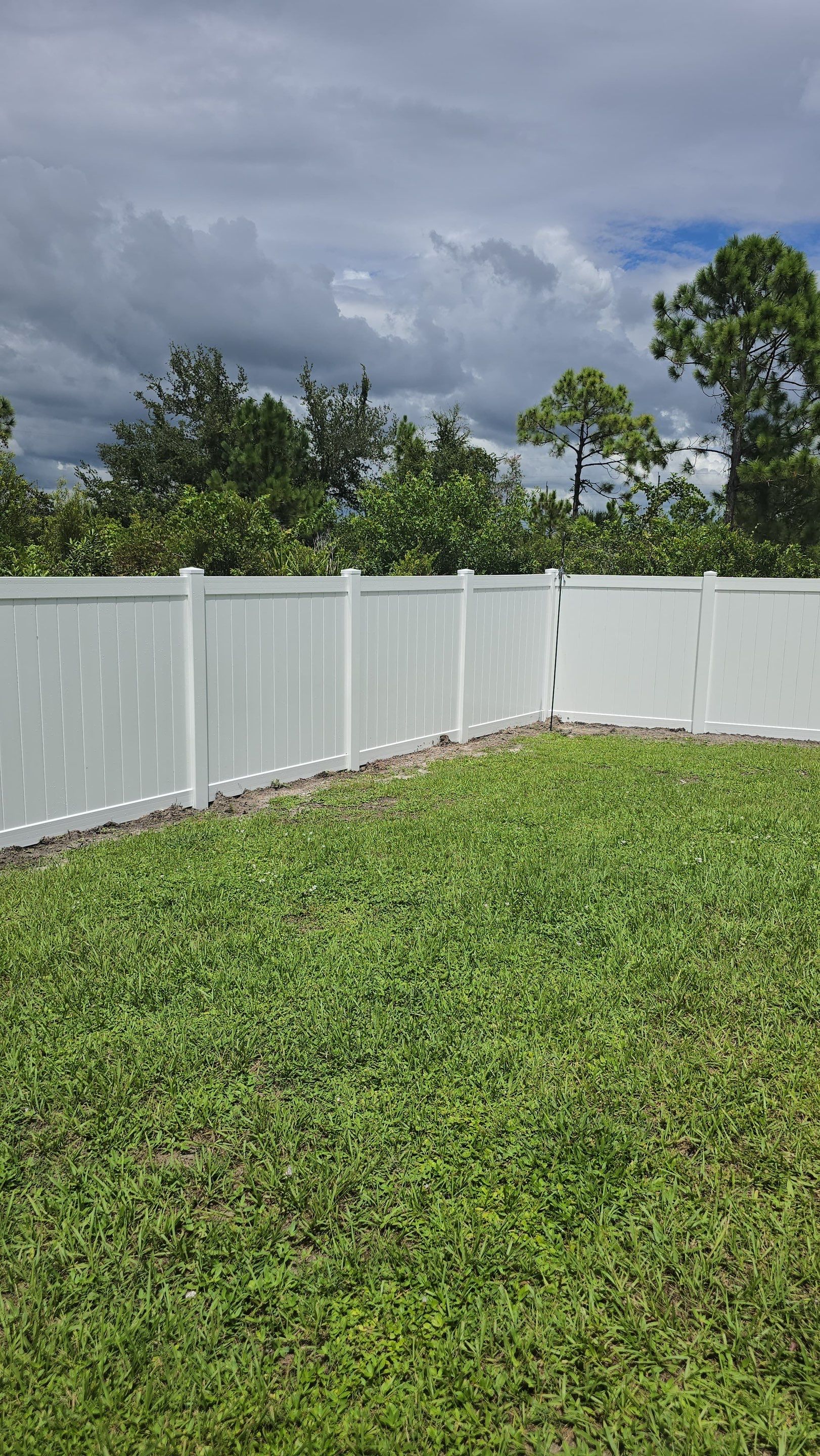 White Vinyl Privacy Fence Installation in Port Charlotte Florida by True Fence LLC