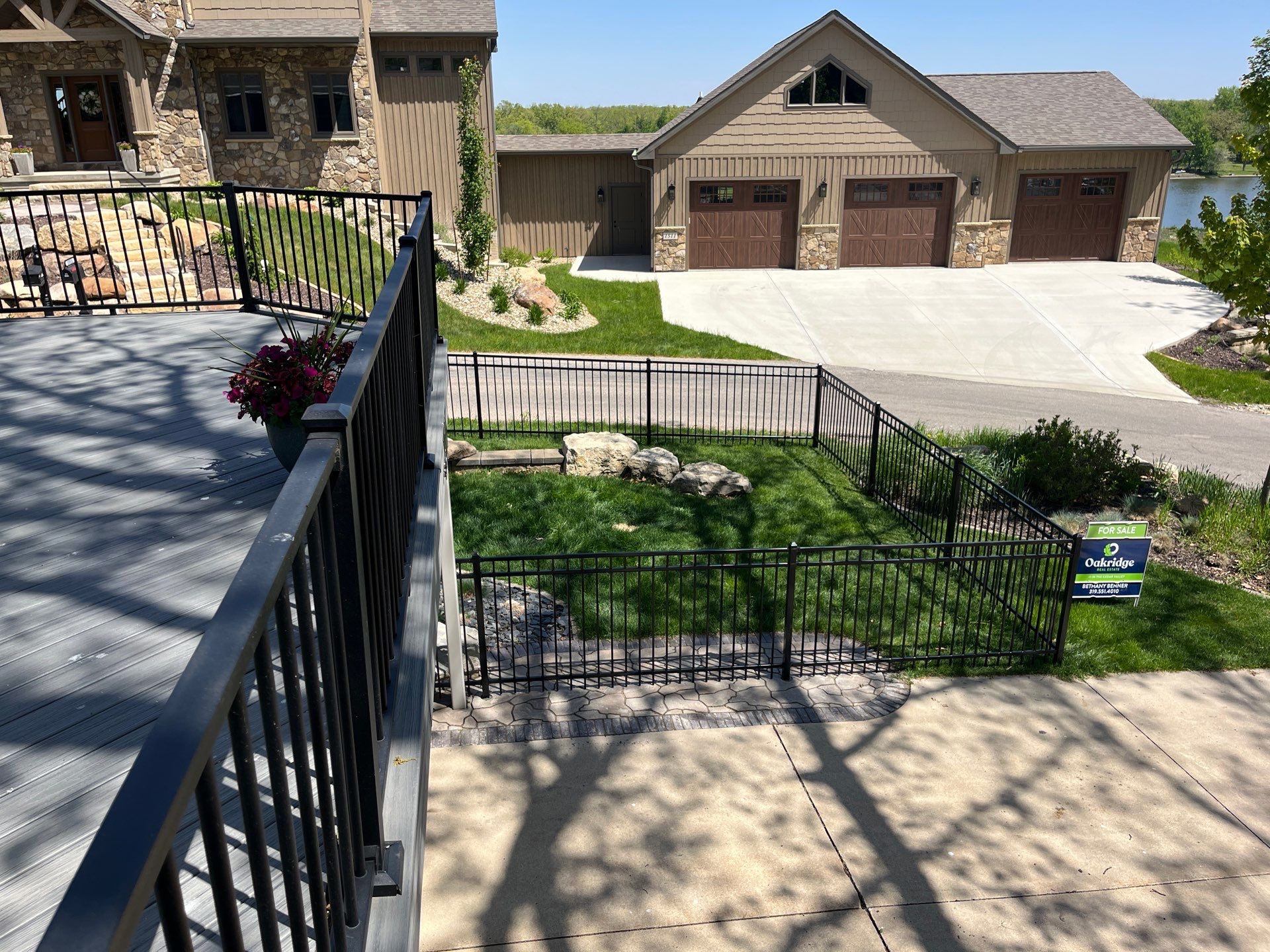 Ornamental Black Metal Picket Fence Installation in Cedar Falls by Perfect Picket Fence and Stain
