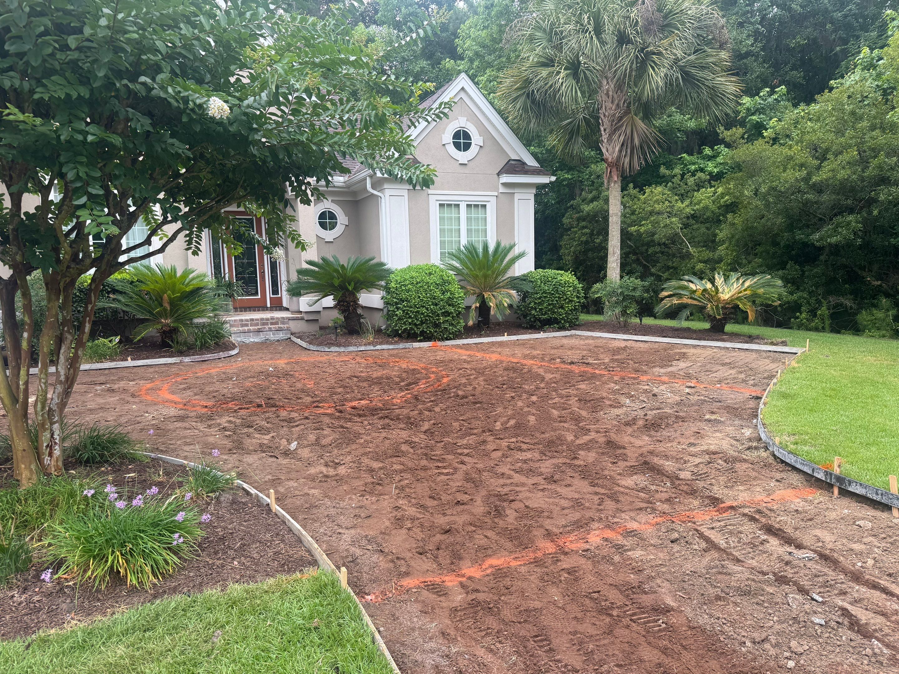 Custom Concrete Driveway and Decorative Paver Installation in Bluffton by Lowcountry Scapes, LLC