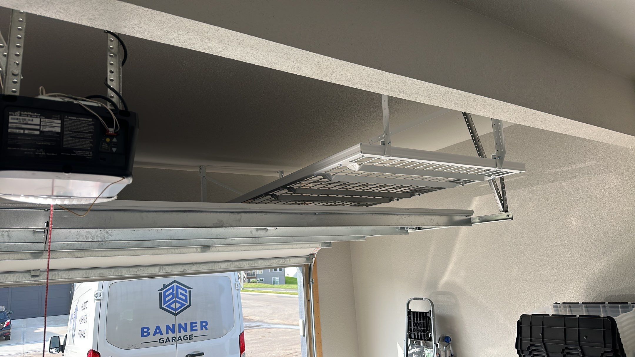 John H. maximized his storage with overhead racks and wall shelves by Banner Garage