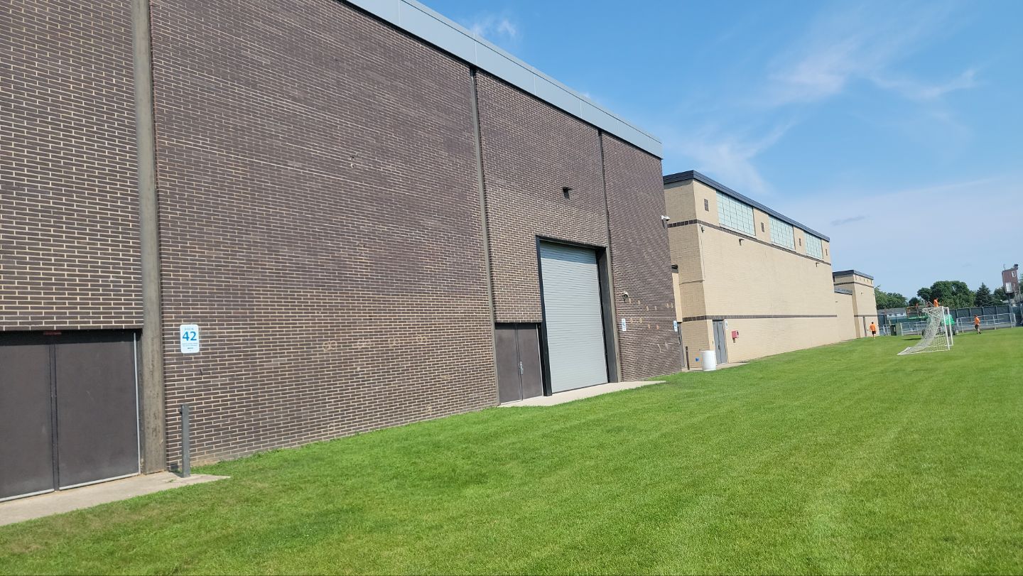 commercial pressure washing using Algaecide, soft wash soap by Northern Power Washing LLC.