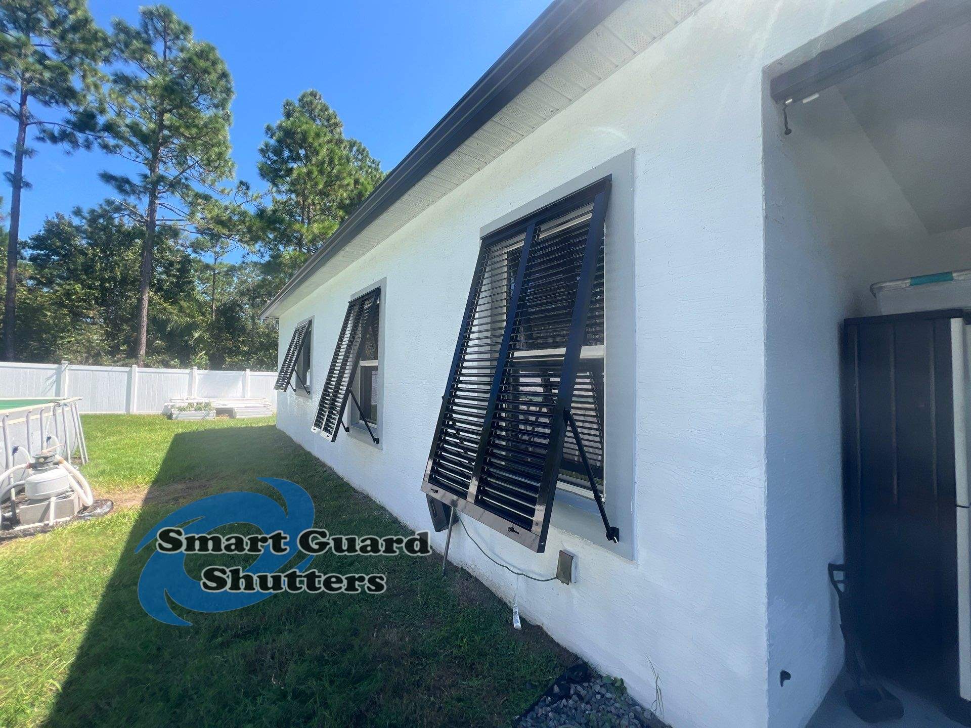 Impact Bahama Shutters in Jet Black by Smart Guard Shutters